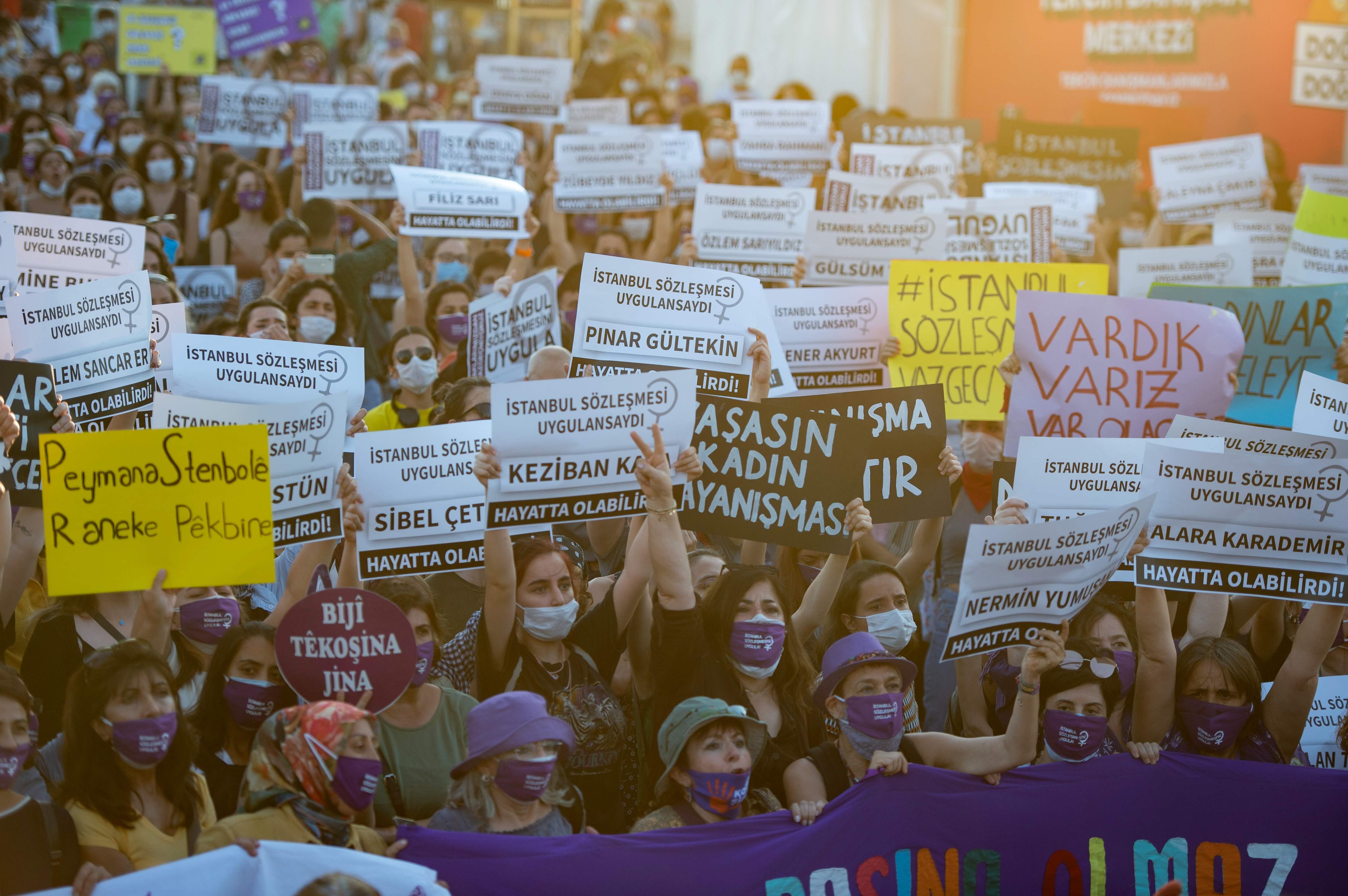 Demonstrators wearing protective face masks hold up placards with names of women during a demonstration for a better implementation of the Istanbul Convention and the Turkish Law 6284 for the protection of the family and prevention of violence against women, in Istanbul, Turkey, on August 5, 2020. (Photo by Yasin AKGUL / AFP)