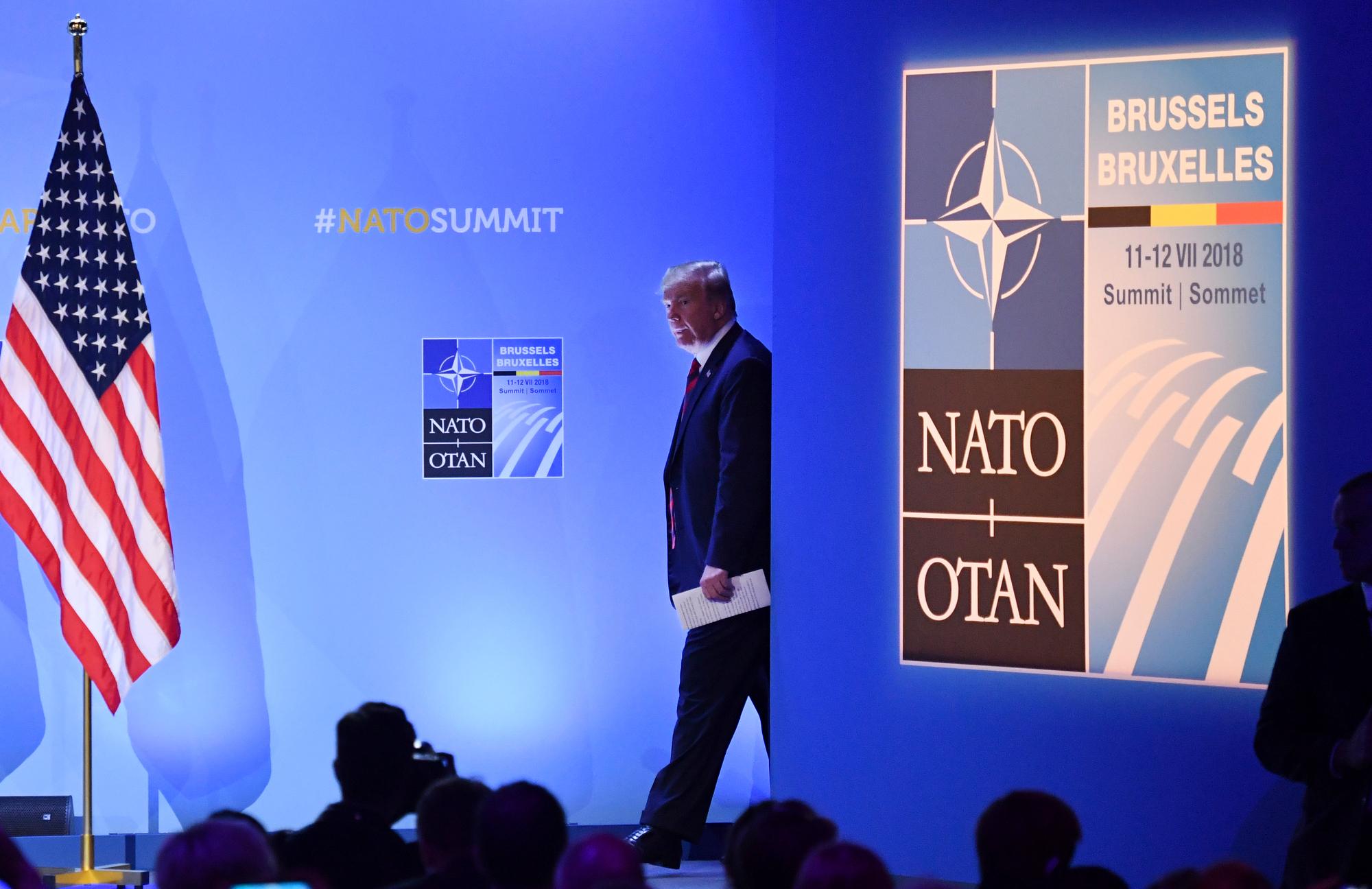 FILE - In this July 12, 2018 file photo, U.S. President Donald Trump arrives for a press conference during a summit of heads of state and government at NATO headquarters in Brussels. NATO Secretary-General Jens Stoltenberg is playing down differences among member countries as the military alliance marks its 70th anniversary in Washington on April 4, 2019. (AP Photo/Geert Vanden Wijngaert, File)