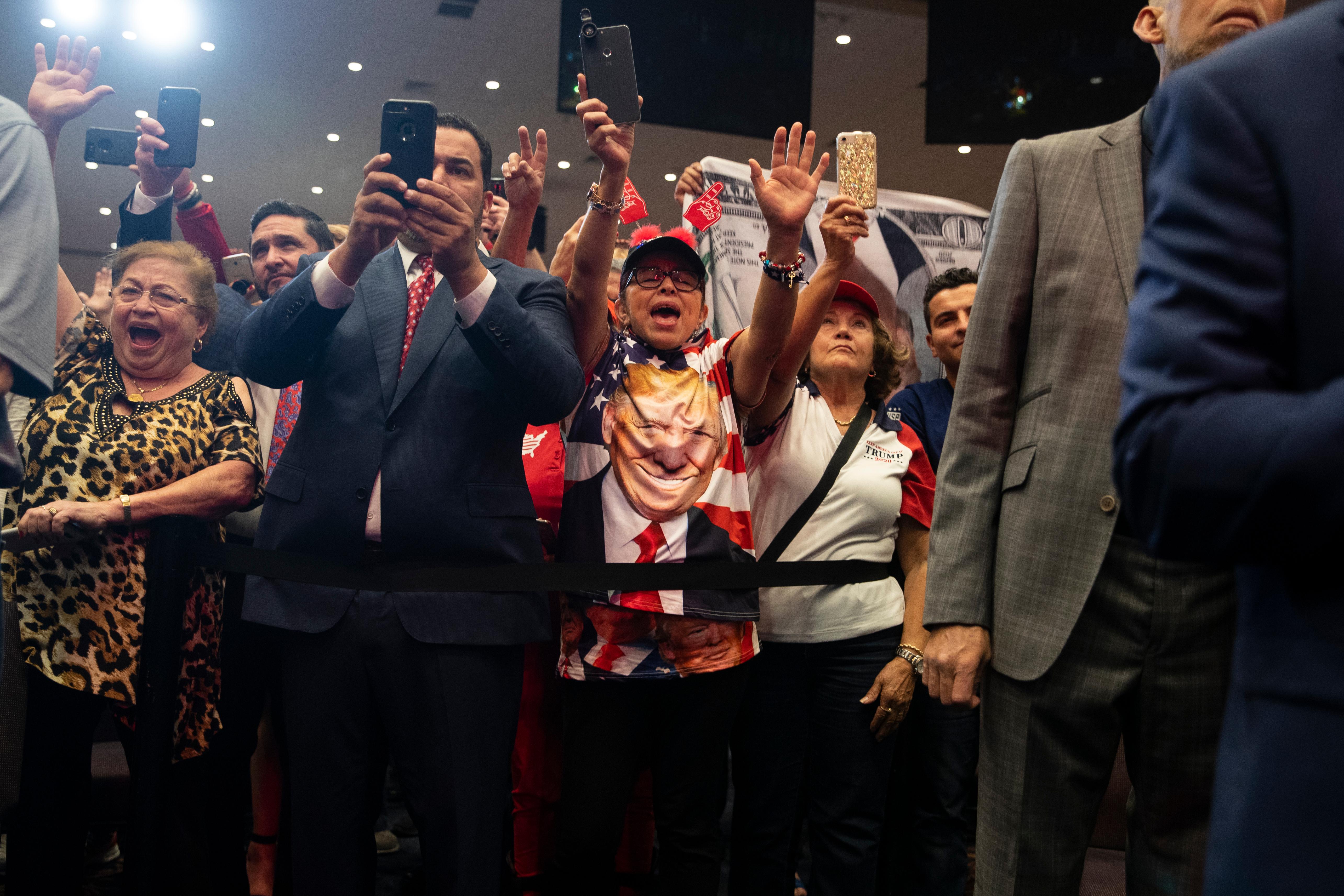 Supporters of President Donald Trump cheer as he arrives to speak during an "Evangelicals for Trump Coalition Launch" at King Jesus International Ministry, Friday, Jan. 3, 2020, in Miami. (AP Photo/ Evan Vucci)