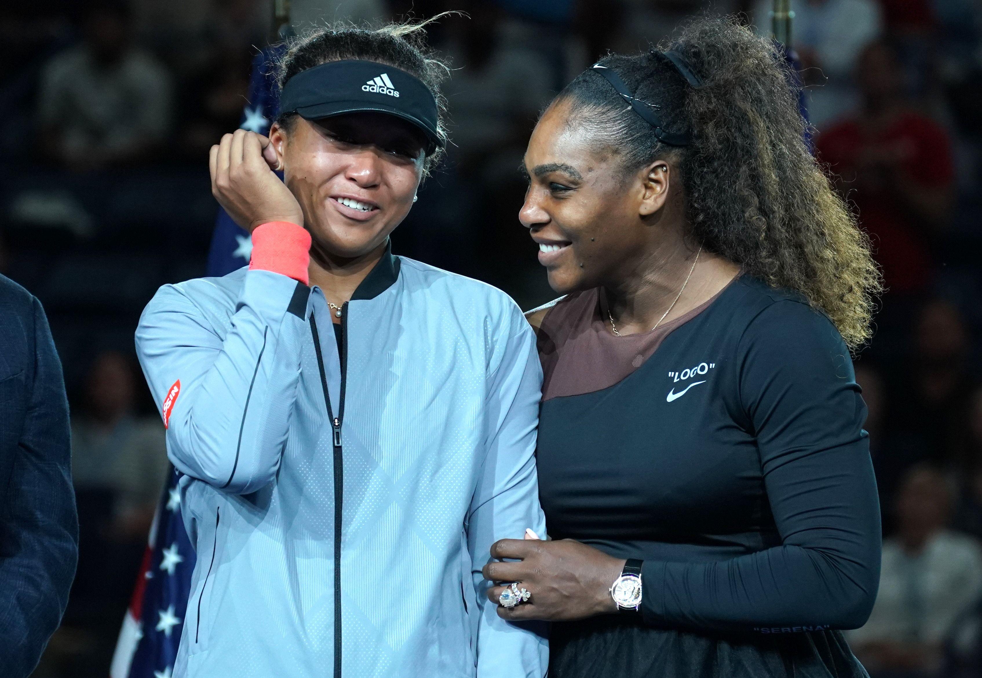 US Open Womens Single champion Naomi Osaka of Japan (L) with Serena Williams of the US during their Women's Singles Finals match at the 2018 US Open at the USTA Billie Jean King National Tennis Center in New York on September 8, 2018. (Photo by TIMOTHY A. CLARY / AFP)
