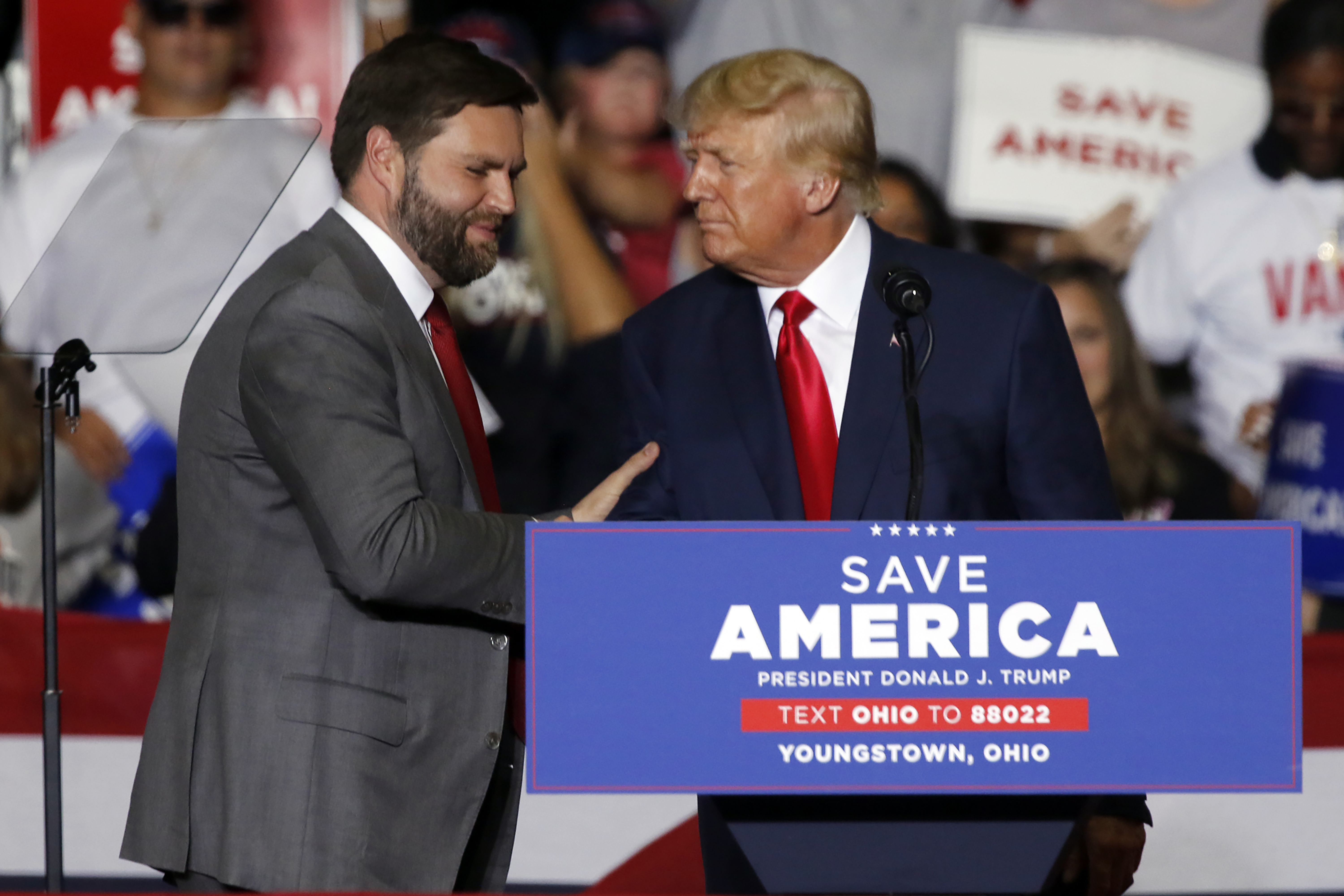 Former President Donald Trump welcomes JD Vance, Republican candidate for U.S. Senator for Ohio, to the stage at a campaign rally in Youngstown, Ohio., Saturday, Sept. 17, 2022. (AP Photo/Tom E. Puskar)