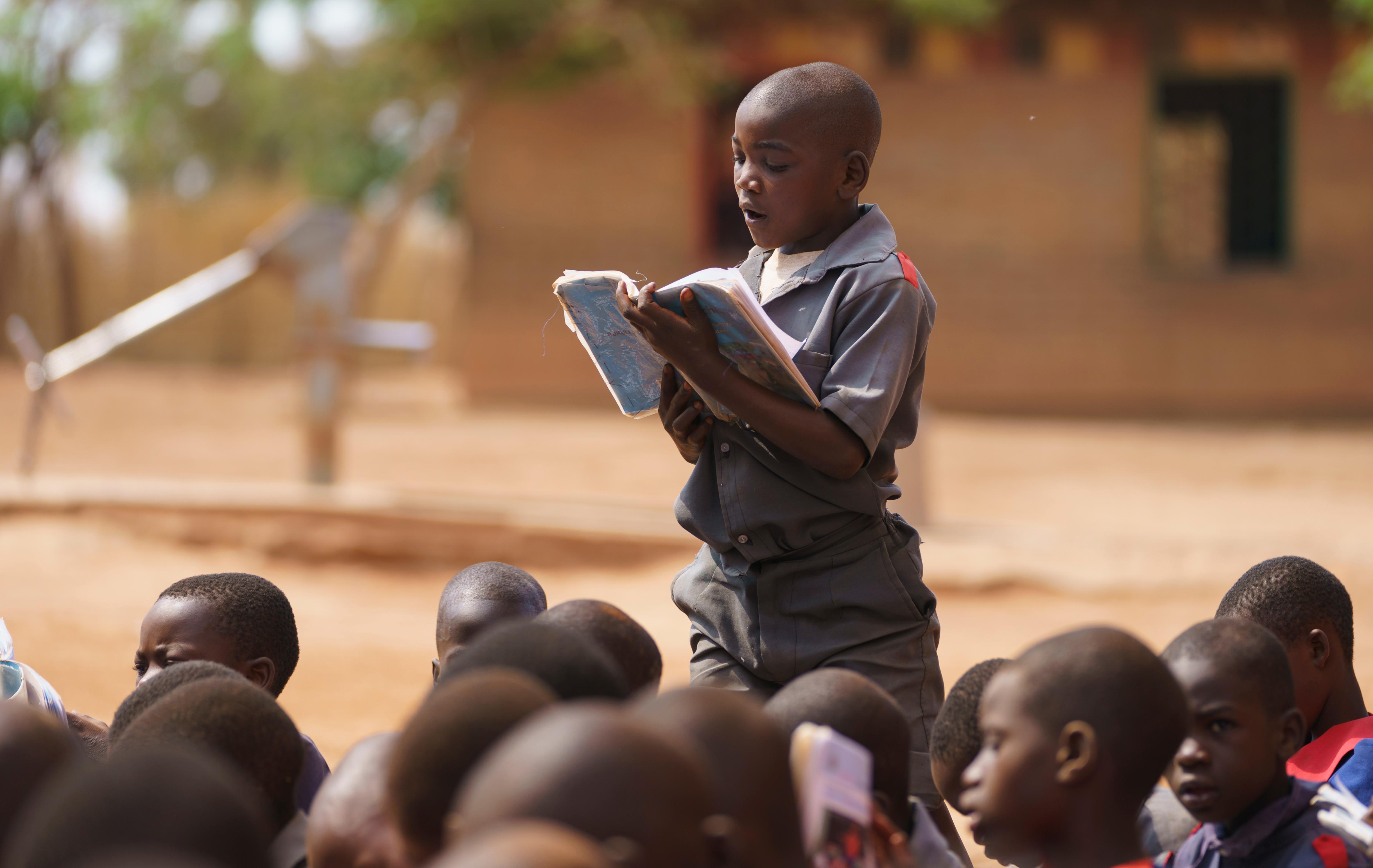 A boy reads aloud during a visit by first lady Melania Trump to Chipala Primary School, in Lilongwe, Malawi, Thursday, Oct. 4, 2018. Melania Trump is visiting Africa on her first big solo international trip, aiming to make child well-being the focus of a five-day, four-country tour. (AP Photo/Carolyn Kaster)