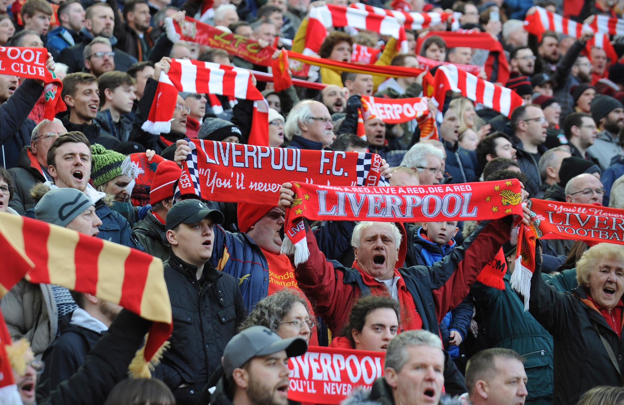 Liverpool supporters cheer prior to the English Premier League soccer match between Liverpool and AFC Bournemouth at Anfield stadium in Liverpool, England, Saturday, Feb. 9, 2019. (AP Photo/Rui Vieira)