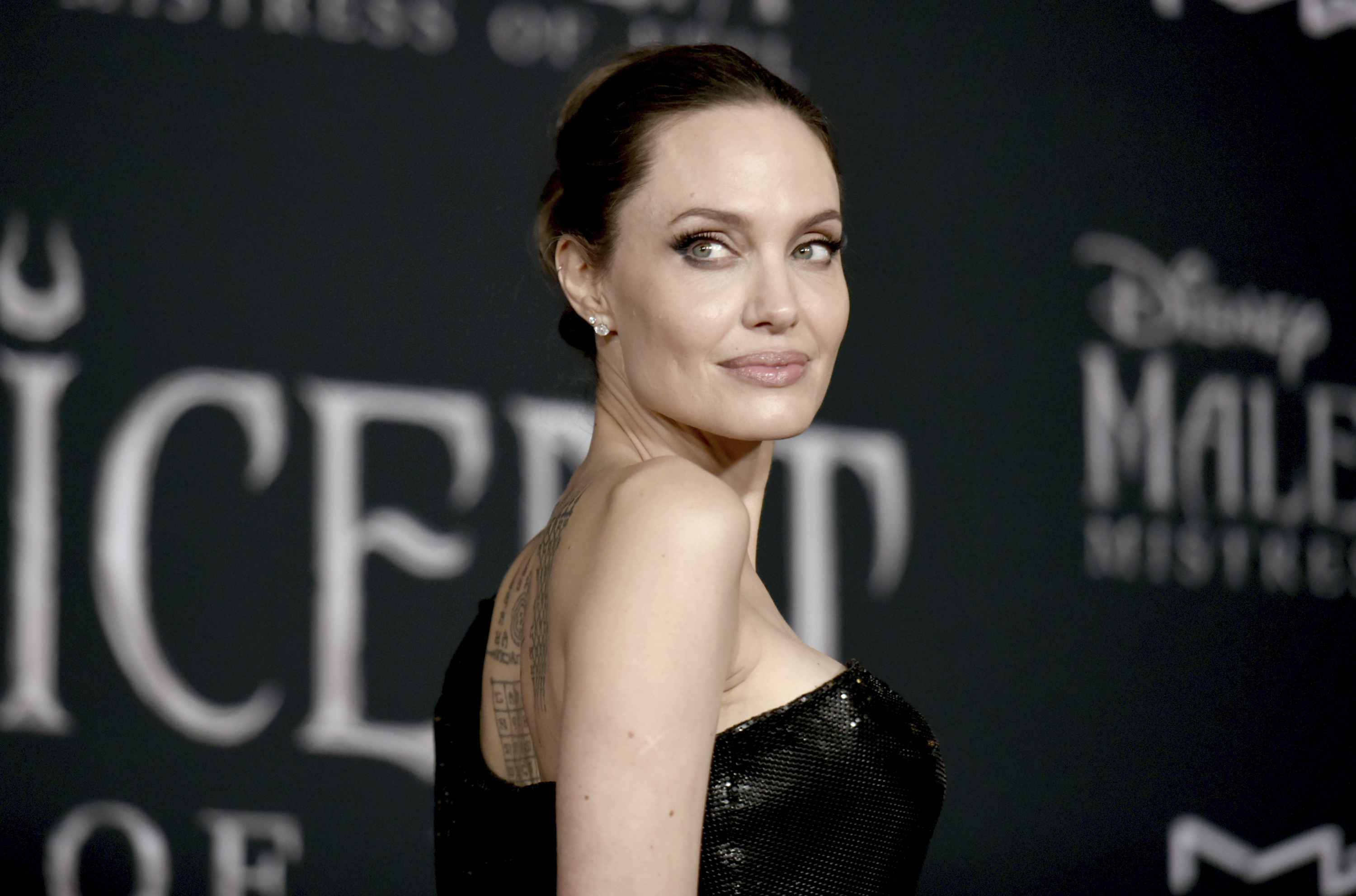 FILE - In this Sept. 30, 2019, file photo, Angelina Jolie arrives at a premiere at the El Capitan Theatre in Los Angeles. Jolie criticized a judge deciding on custody arrangements for her and Brad Pitt's children during their divorce, saying in a court filing on Monday, May 24, 2021, that the judge refused to allow their kids to testify. (Photo by Richard Shotwell/Invision/AP)
