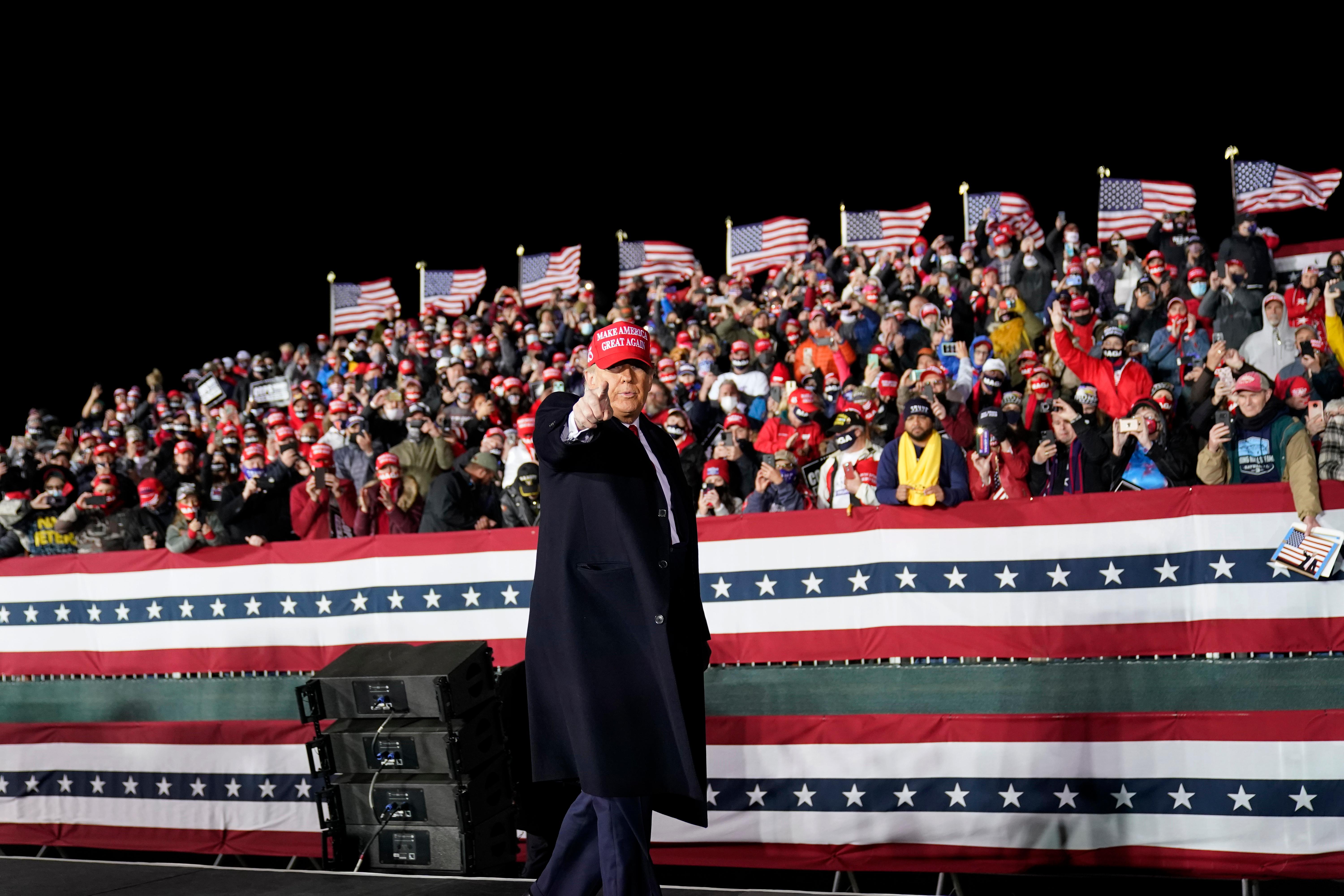 President Donald Trump reacts after speaking during a campaign rally at Southern Wisconsin Regional Airport, Saturday, Oct. 17, 2020, in Janesville, Wis. (AP Photo/Alex Brandon)