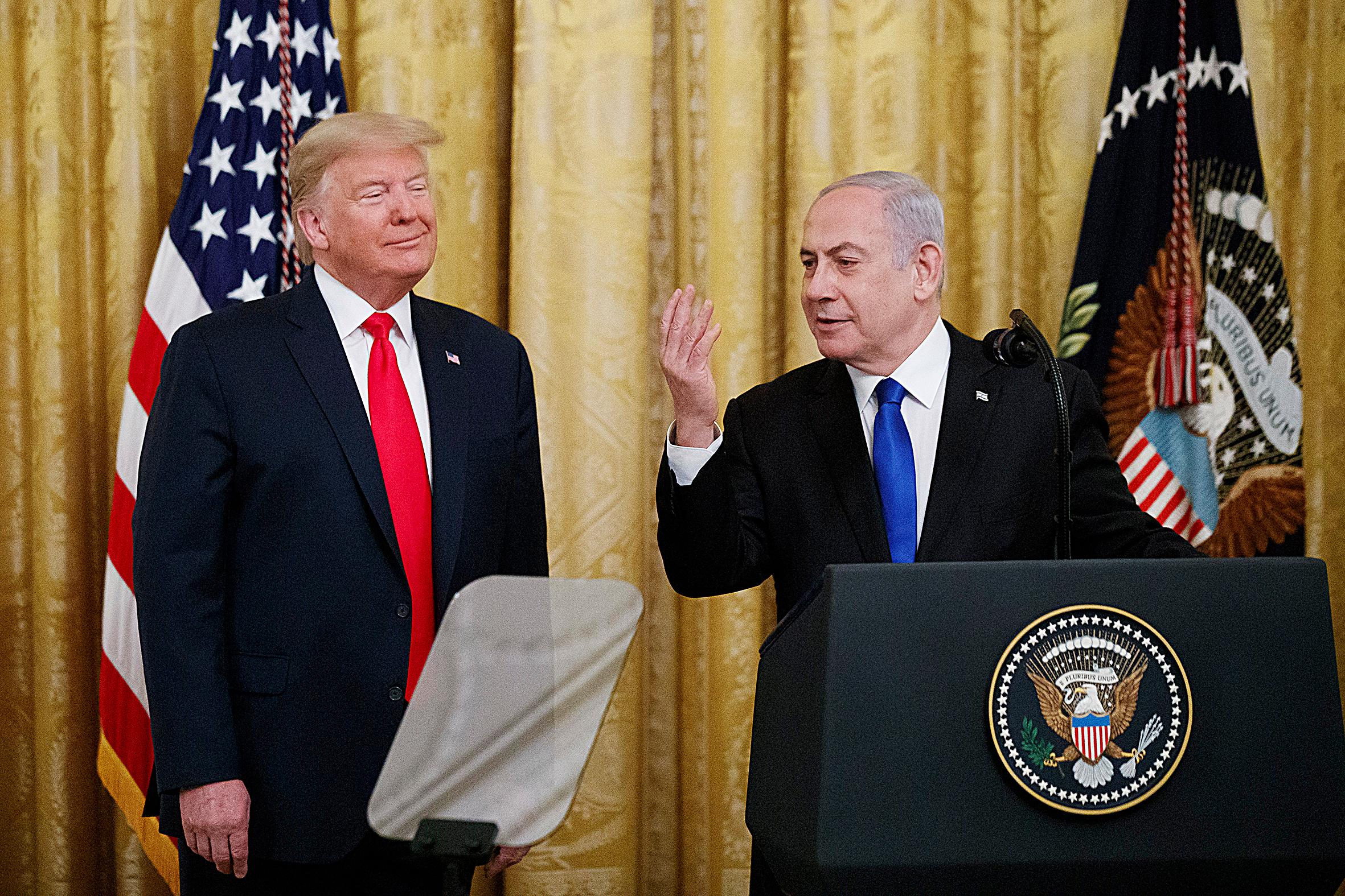 Israeli Prime Minister Benjamin Netanyahu speaks during an event with President Donald Trump in the East Room of the White House in Washington, Tuesday, Jan. 28, 2020, to announce the Trump administration's much-anticipated plan to resolve the Israeli-Palestinian conflict. (AP Photo/Alex Brandon)