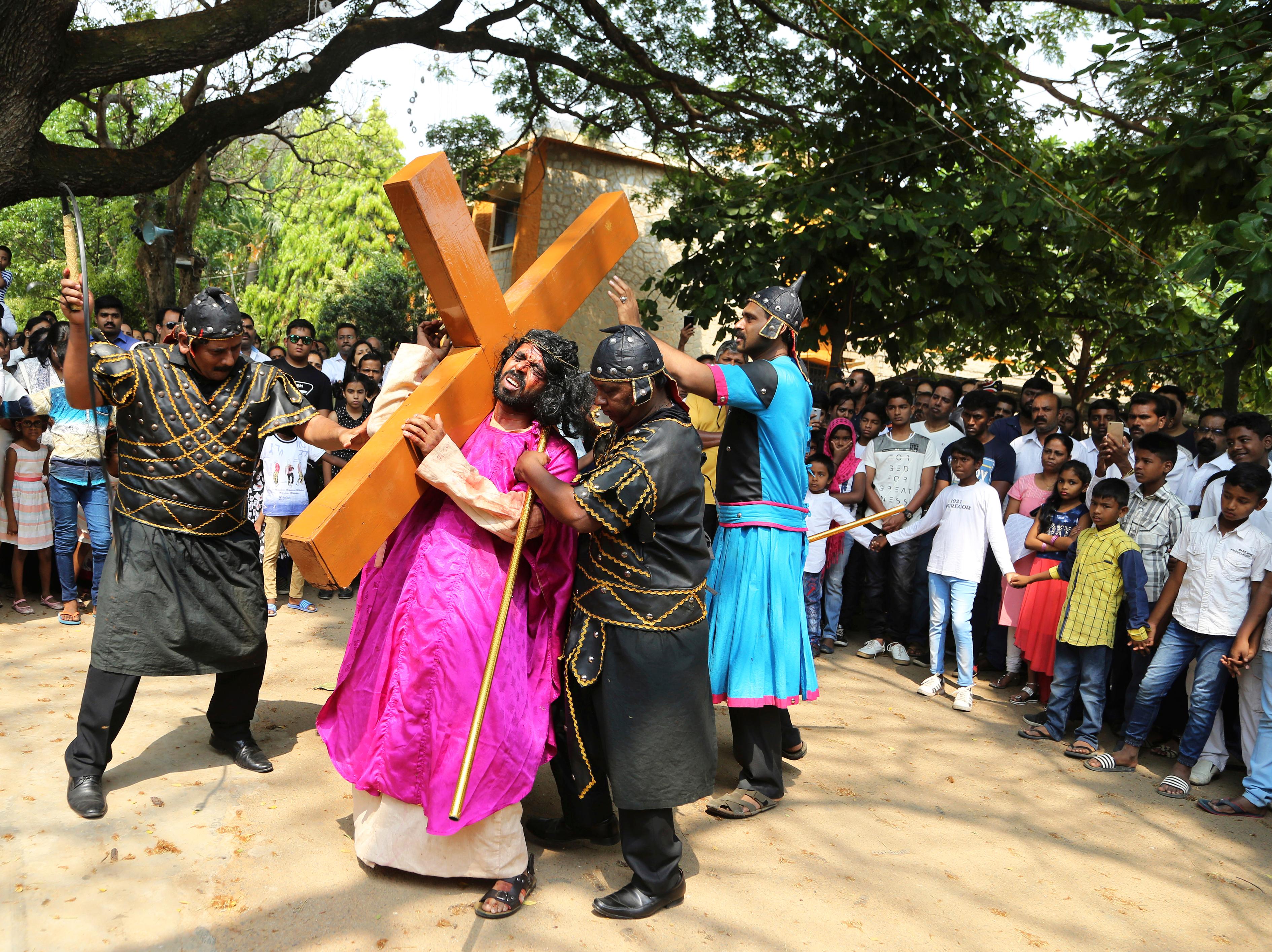 Christian devotees reenact the crucifixion of Jesus Christ to mark Good Friday in Bangalore, India, Friday, March 30, 2018. Christians around the world are marking the death of Jesus Christ ahead of Easter Sunday. (AP Photo/Aijaz Rahi)