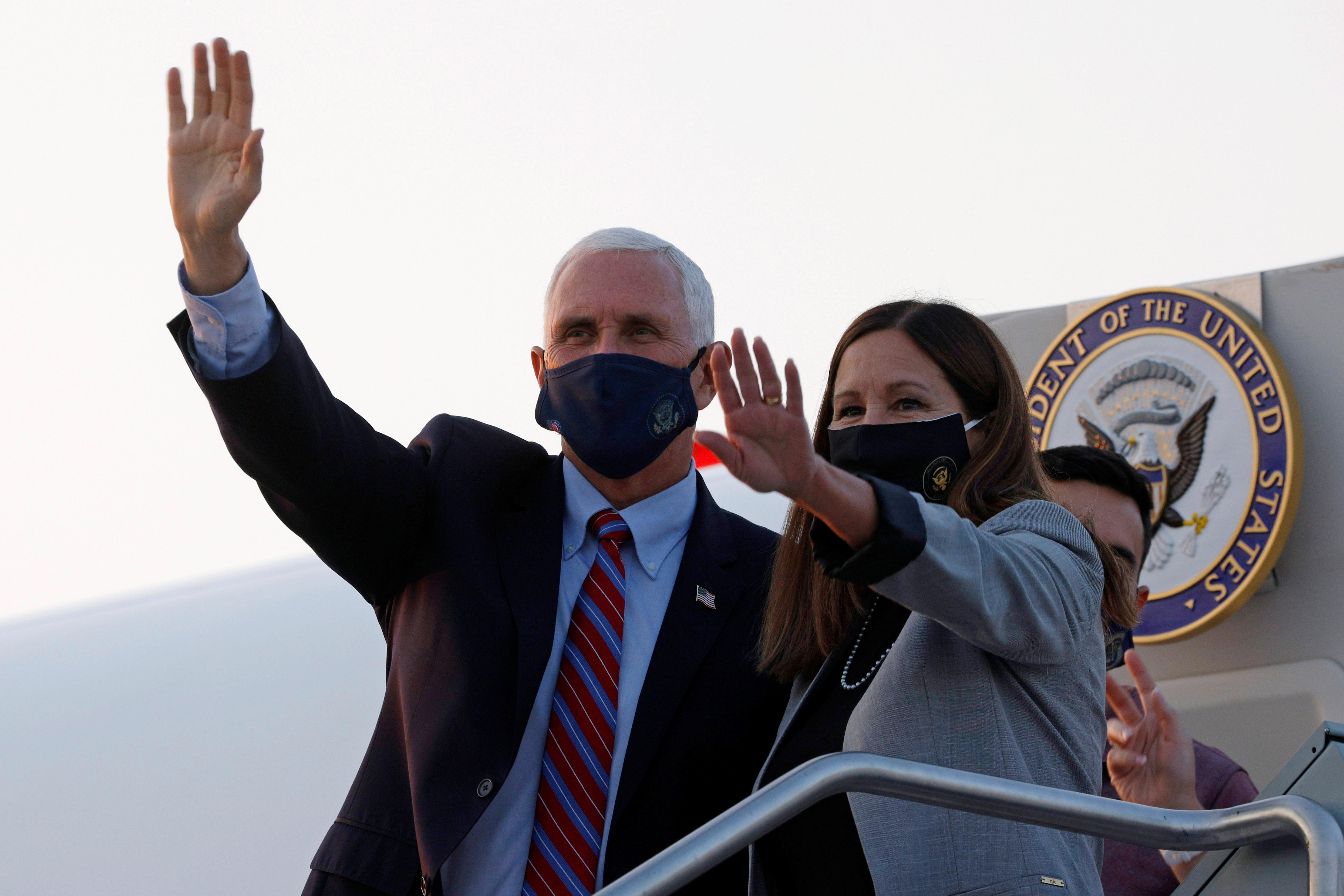 U.S. Vice President Mike Pence and his wife Karen arrive ahead of the vice presidential debate in Salt Lake City, Utah, U.S., October 5, 2020.   REUTERS/Brian Snyder