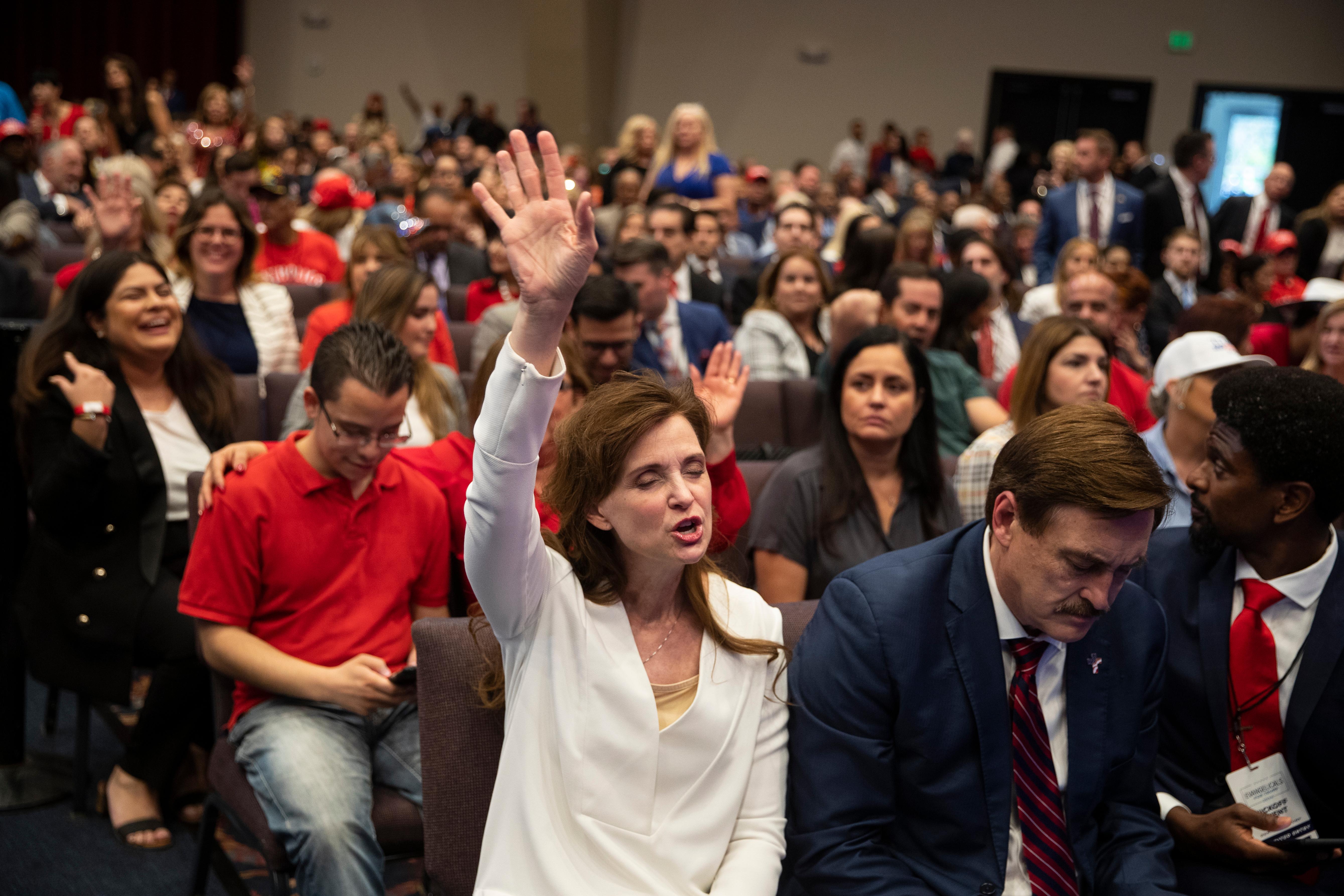 Supporters of President Donald Trump pray during an "Evangelicals for Trump Coalition Launch" at King Jesus International Ministry, Friday, Jan. 3, 2020, in Miami. (AP Photo/ Evan Vucci)