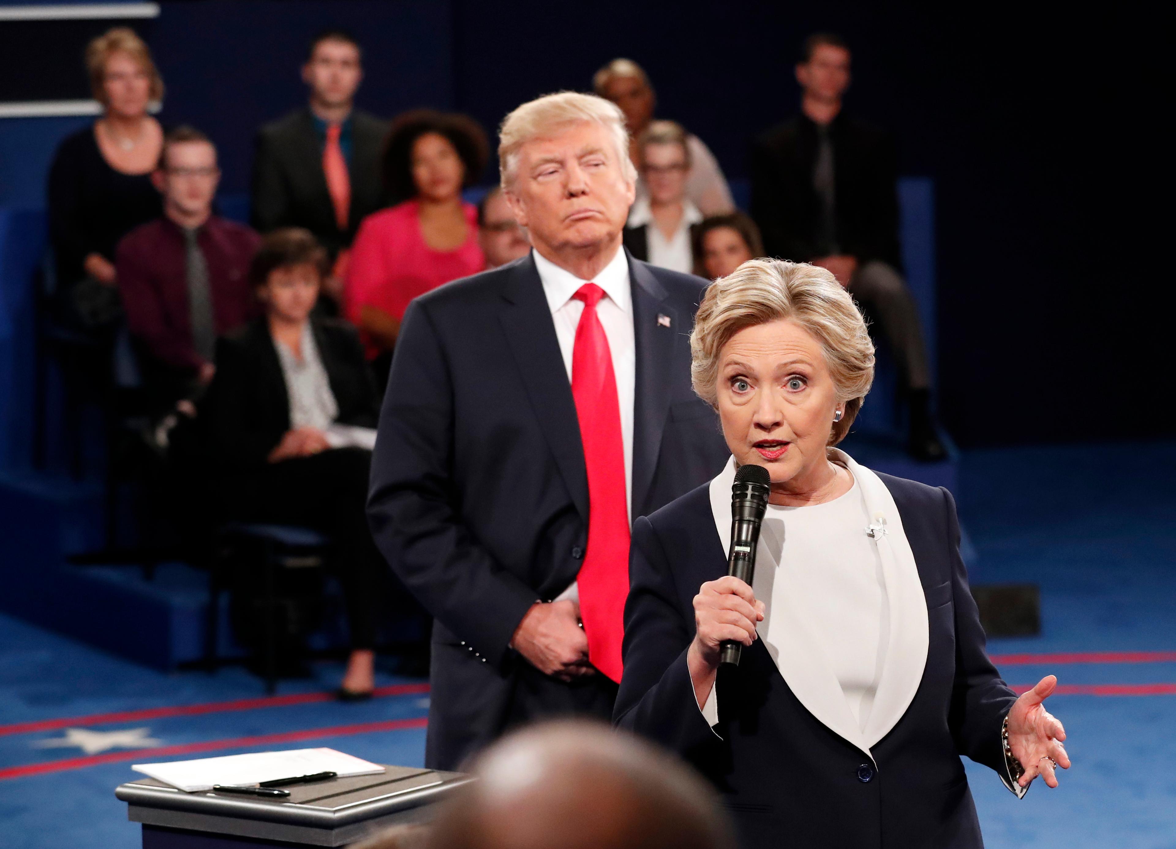 Democratic presidential nominee Hillary Clinton, right, speaks as Republican presidential nominee Donald Trump listens during the second presidential debate at Washington University in St. Louis, Sunday, Oct. 9, 2016. (Rick T. Wilking/Pool via AP)