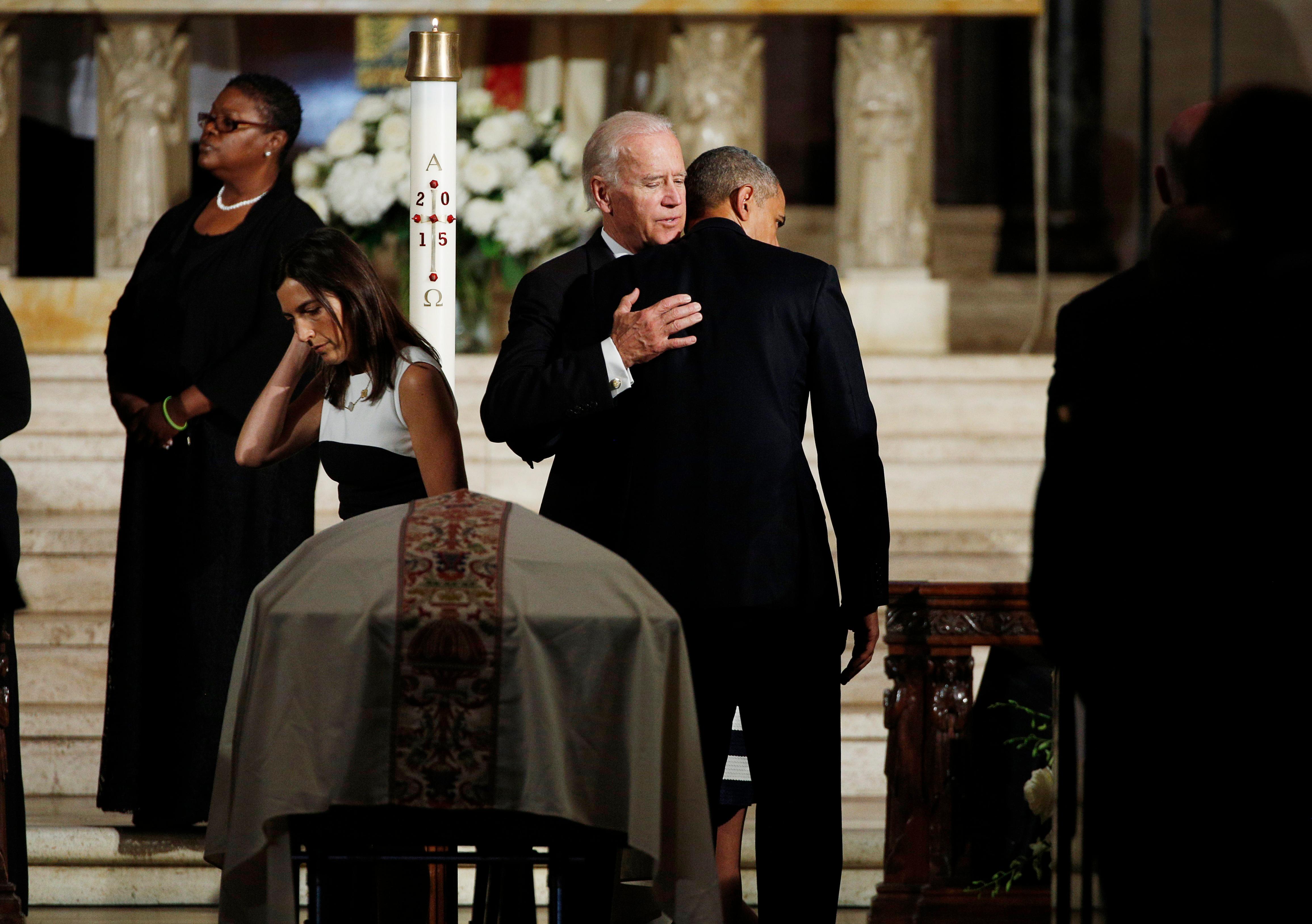 Vice President Joe Biden and President Barack Obama hug during funeral services for Biden's son, Beau Biden, Saturday, June 6, 2015, at St. Anthony of Padua Roman Catholic Church in Wilmington, Del. (Kevin Lamarque/Pool Photo via AP)