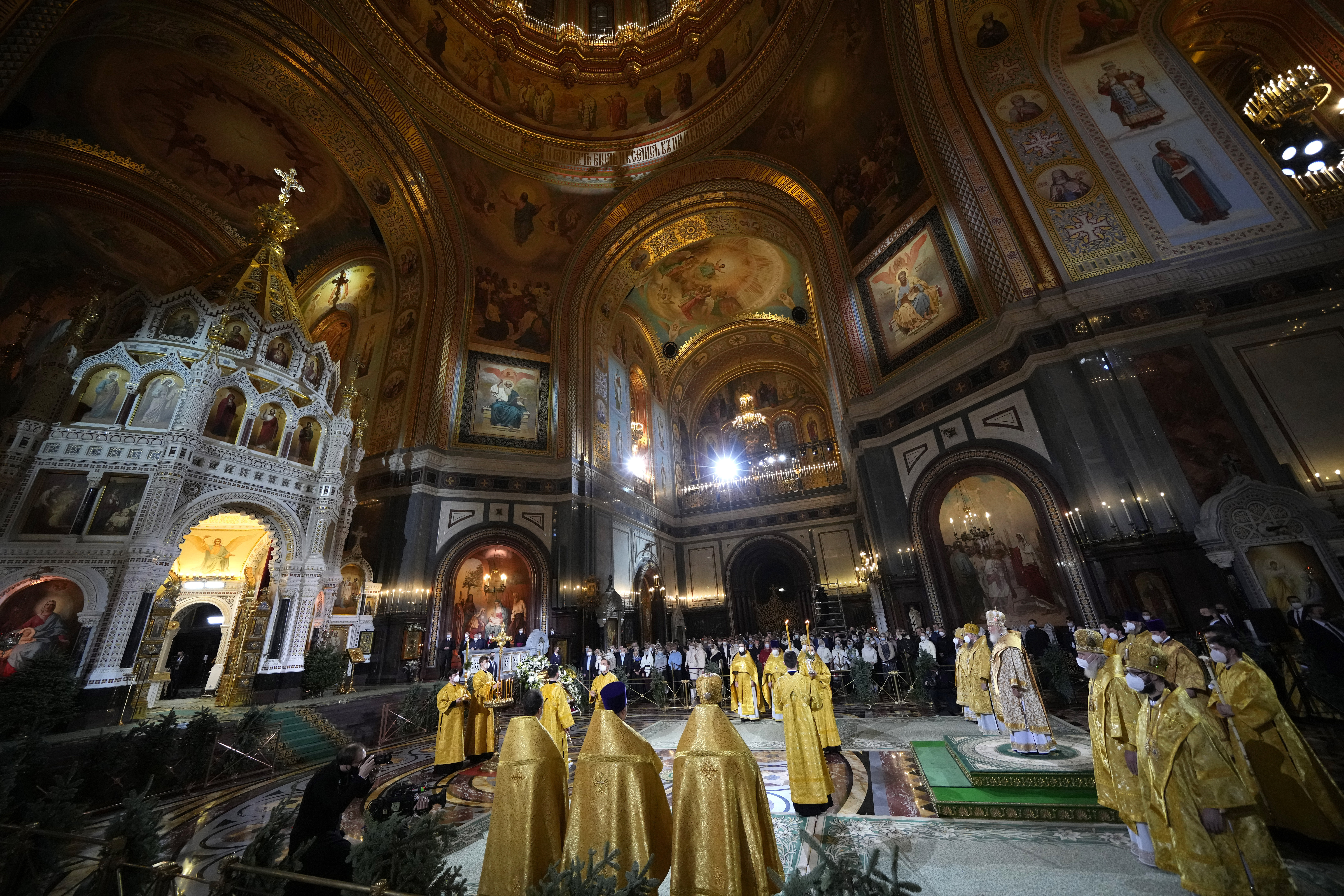 Russian Orthodox Patriarch Kirill delivers the Christmas Mass in the Christ the Saviour Cathedral in Moscow, Russia, Thursday, Jan. 6, 2022. Parishioners wearing face masks to protect against coronavirus, observed social distancing guidelines as they attended the the Mass. Orthodox Christians celebrate Christmas on Jan. 7, in accordance with the Julian calendar. (AP Photo/Alexander Zemlianichenko)