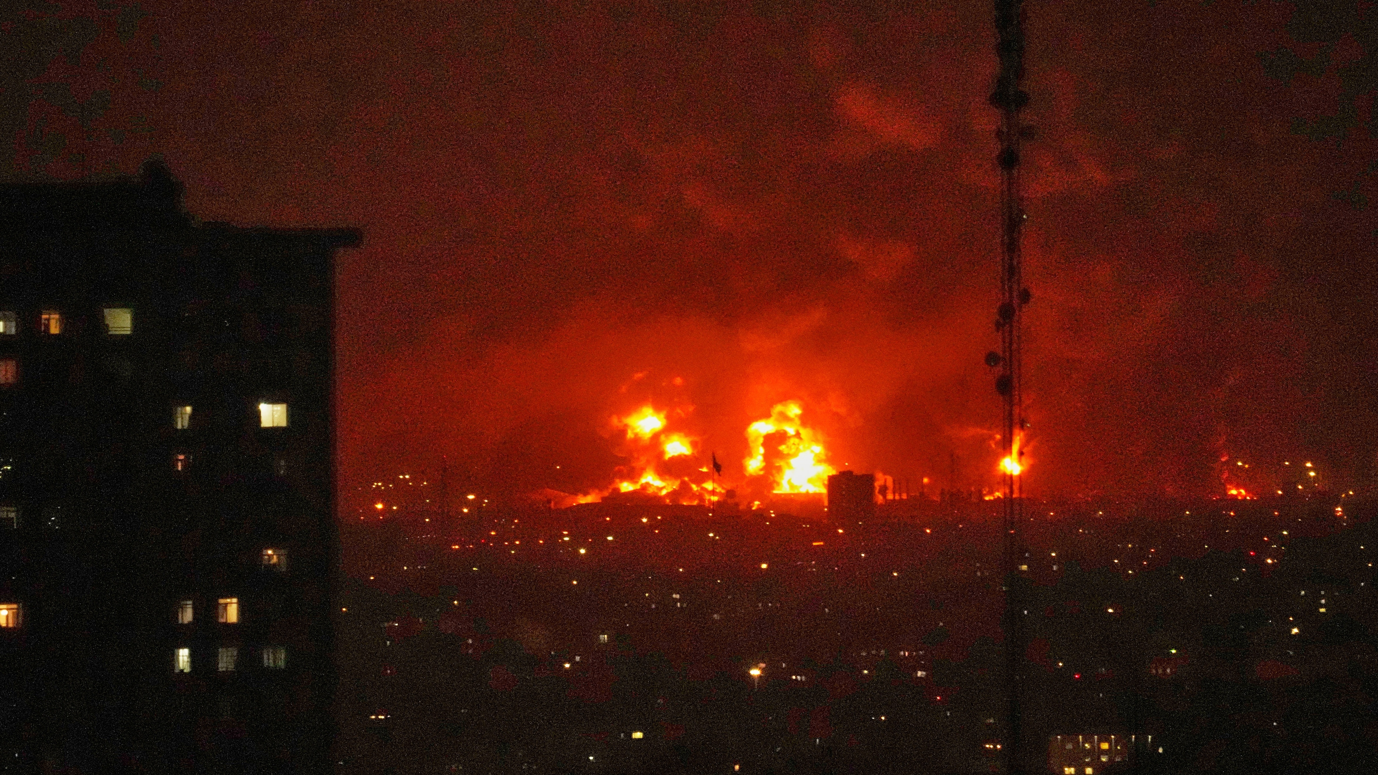 Flames rise from an oil storage facility south of the capital Tehran as strikes hit the city during the U.S.Israel military campaign, Iran, Saturday, March 7, 2026. (AP Photo/Vahid Salemi)