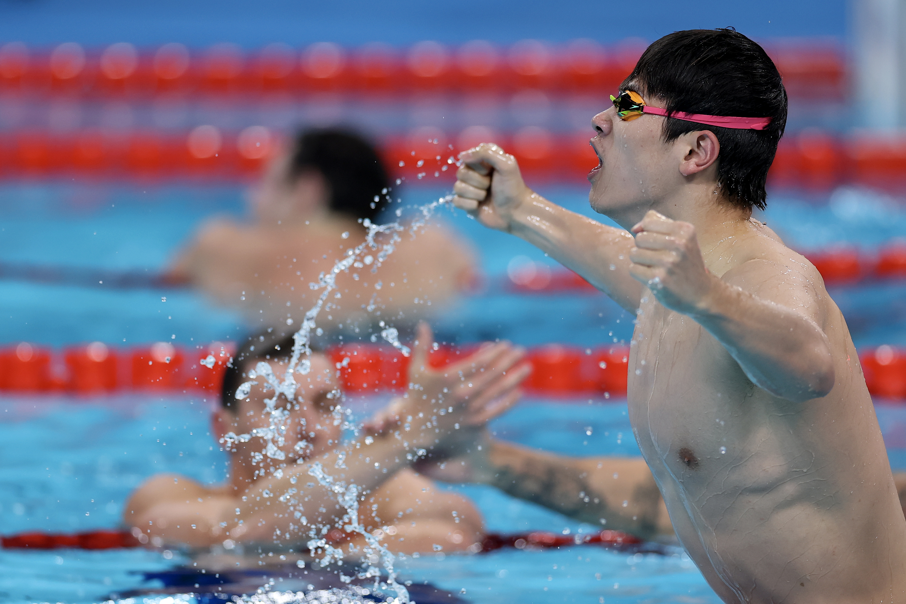 NANTERRE, FRANCE - JULY 31: Zhanle Pan of Team People's Republic of China celebrates after winning gold in a world record time in the Men's 100m Freestyle Final on day five of the Olympic Games Paris 2024 at Paris La Defense Arena on July 31, 2024 in Nanterre, France. (Photo by Maddie Meyer/Getty Images)