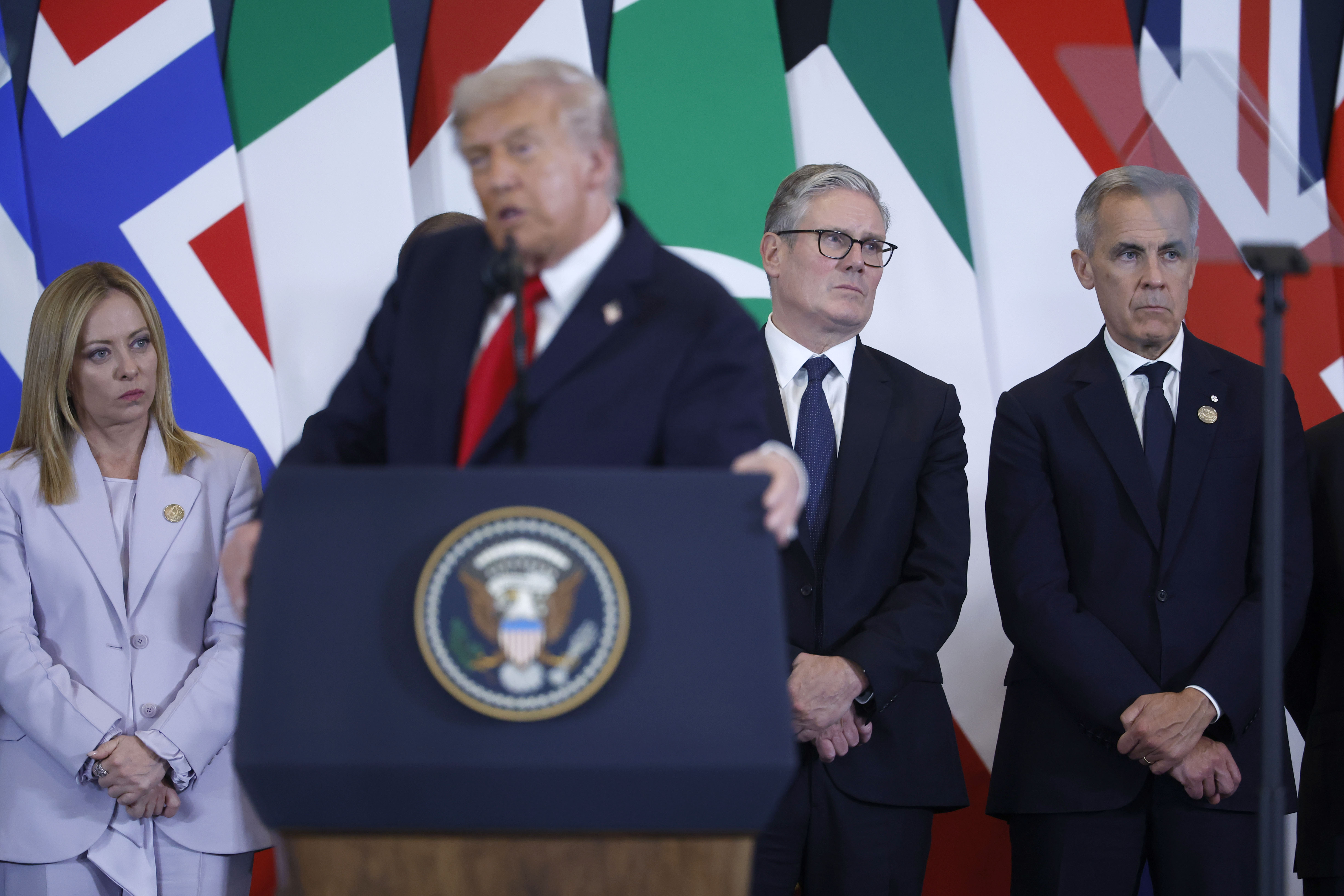 SHARM EL-SHEIKH, EGYPT - OCTOBER 13: U.S. President Donald Trump speaks while (L-R) Italy's Prime Minister Giorgia Meloni, British Prime Minister Keir Starmer and Canadian Prime Minister Mark Carney listen during a summit of European and Middle Eastern leaders on Gaza on October 13, 2025 in Sharm El-Sheikh, Egypt. President Trump is in Egypt to meet with European and Middle Eastern leaders in whats being billed as an international peace summit, following the start of a US-brokered ceasefire deal to end the war in the Gaza Strip. (Photo by Chip Somodevilla/Getty Images)