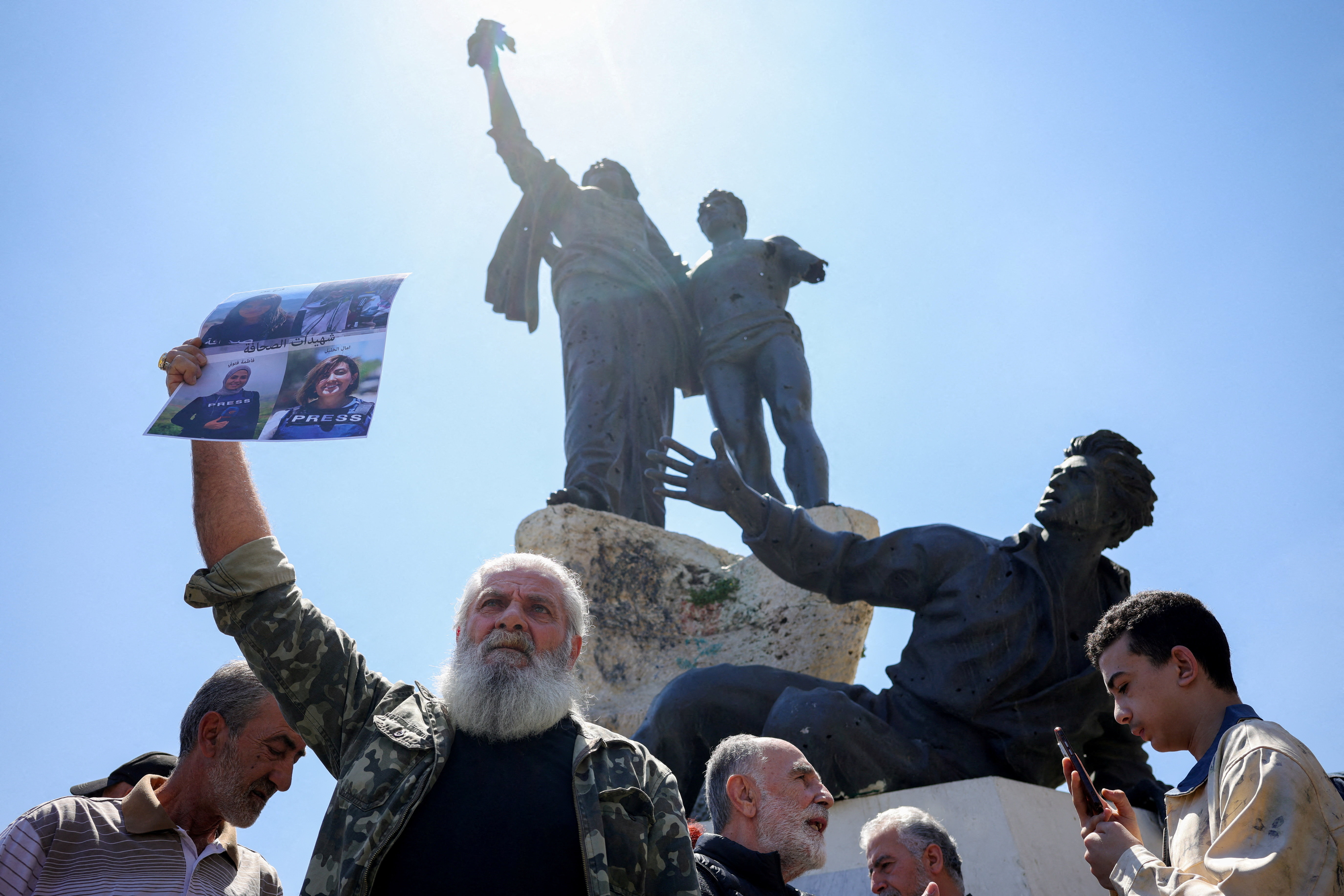 Protesters, including members of the media, attend a vigil to condemn the killing of journalists, a day after journalist Amal Khalil was killed in an Israeli strike, in Martyrs' Square, Beirut, Lebanon April 23, 2026. REUTERS/Marko Djurica     TPX IMAGES OF THE DAY     
