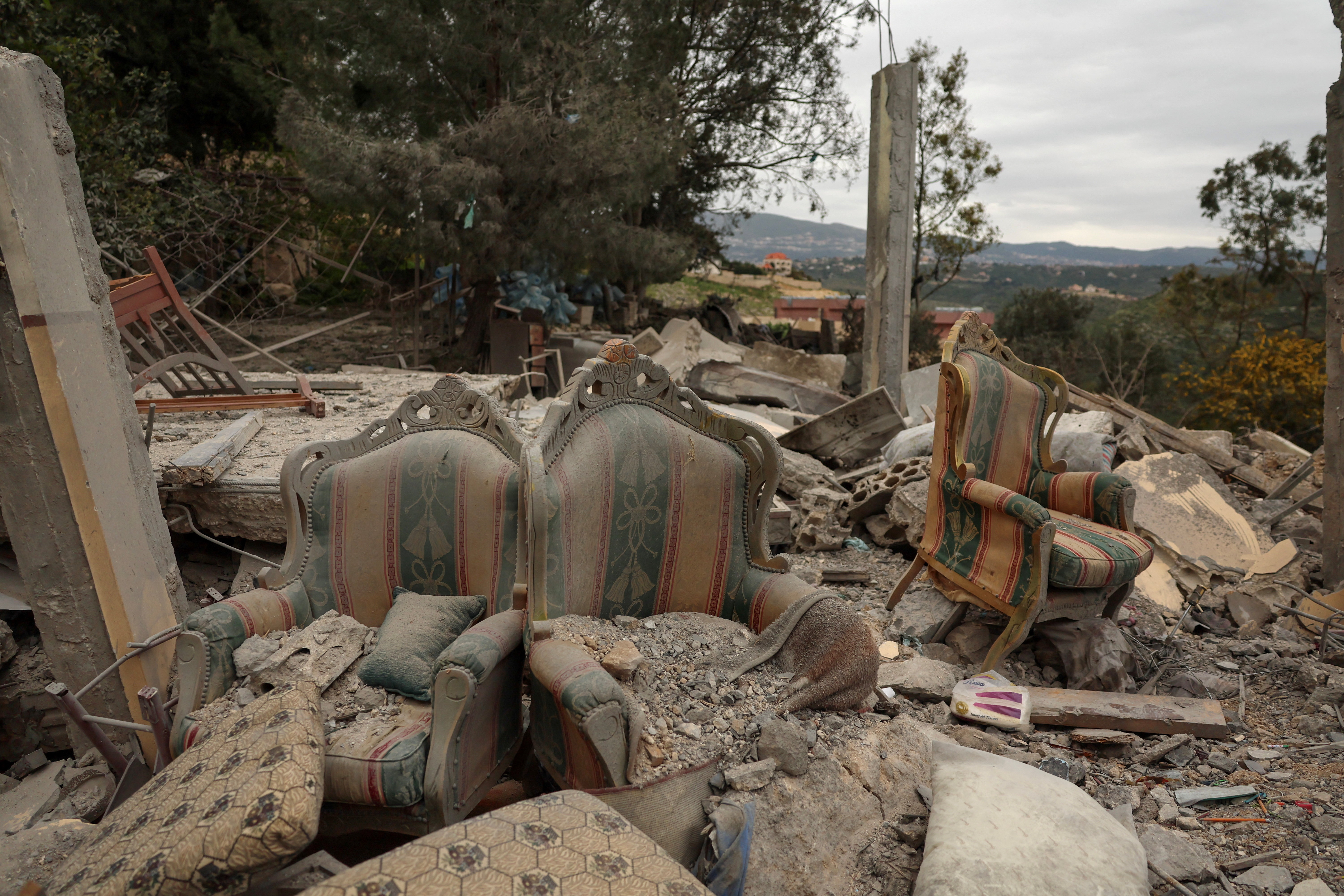 Armchairs among the rubble of a house destroyed by an Israeli strike, amid escalating hostilities between Israel and Hezbollah, as the U.S.-Israel conflict with Iran continues, in Houmine El Tahta, Lebanon, April 1, 2026. REUTERS/Yara Nardi