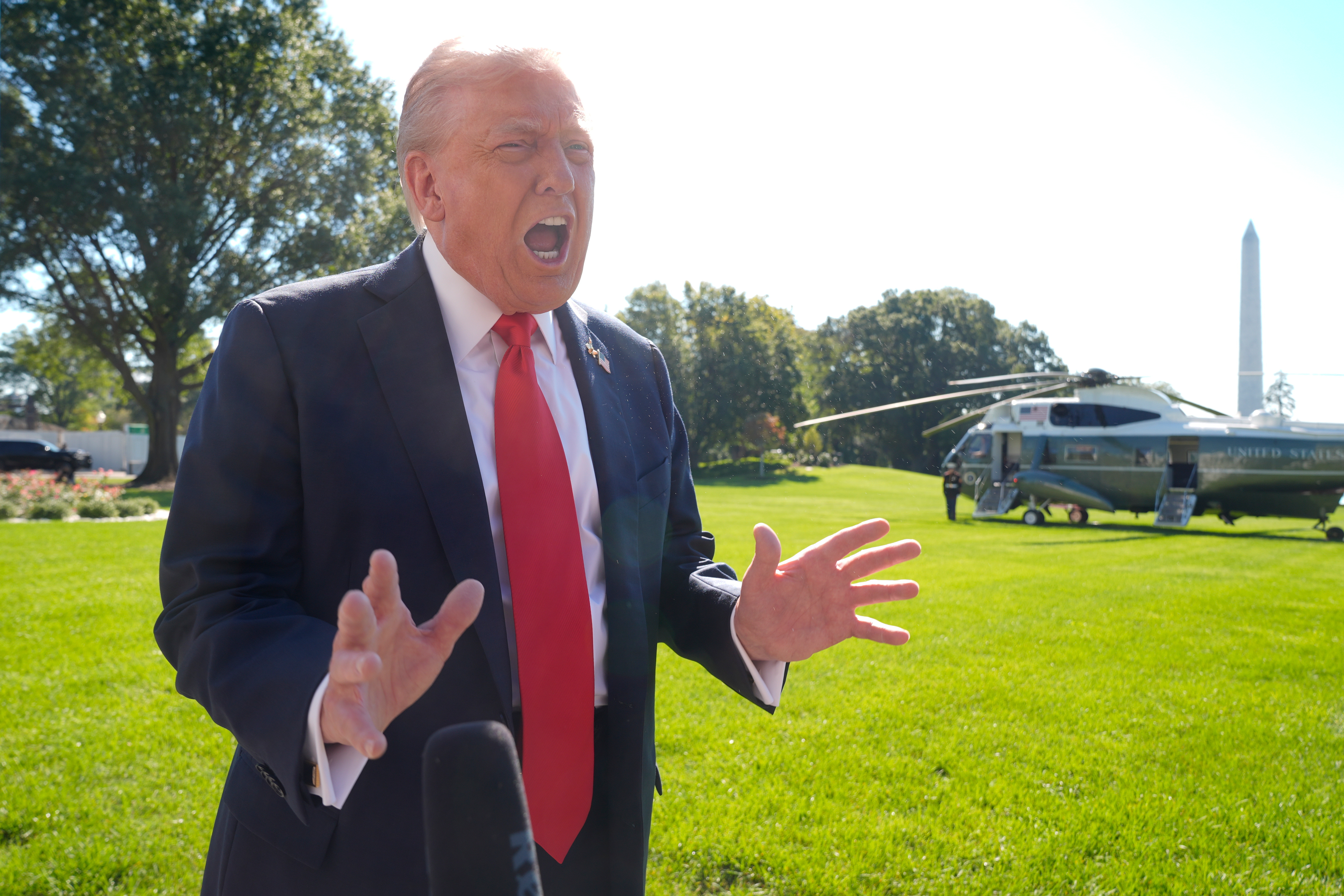 President Donald Trump speaks to reporters before departing the White House, en route Norfolk, Va., to observe a naval sea power demonstration, Sunday, Oct. 5, 2025, in Washington. (AP Photo/Manuel Balce Ceneta)