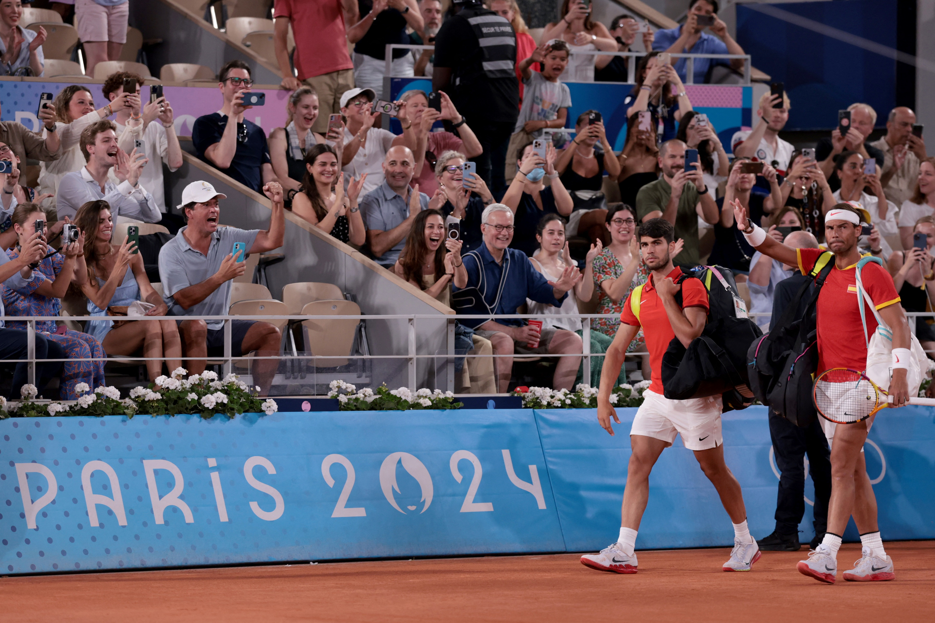 Paris 2024 Olympics - Tennis - Men's Doubles Quarterfinals - Roland-Garros Stadium, Paris, France - July 31, 2024. Carlos Alcaraz of Spain and Rafael Nadal of Spain arrive for their match against Austin Krajicek of United States and Rajeev Ram of United States. REUTERS/Claudia Greco