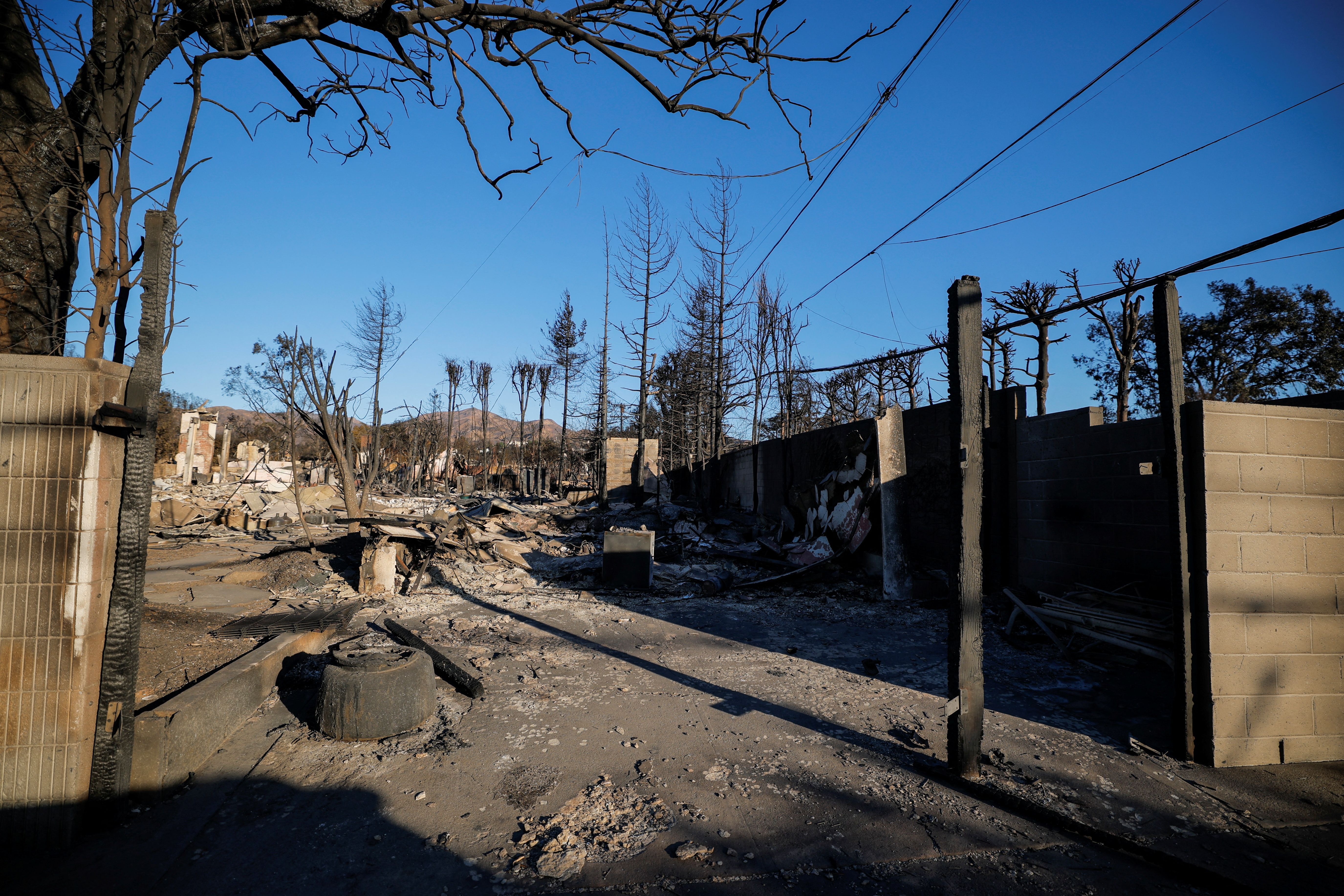 Burned properties following the Palisades Fire at the Pacific Palisades neighborhood in Los Angeles, California, U.S.  January 13, 2025. REUTERS/Mike Blake