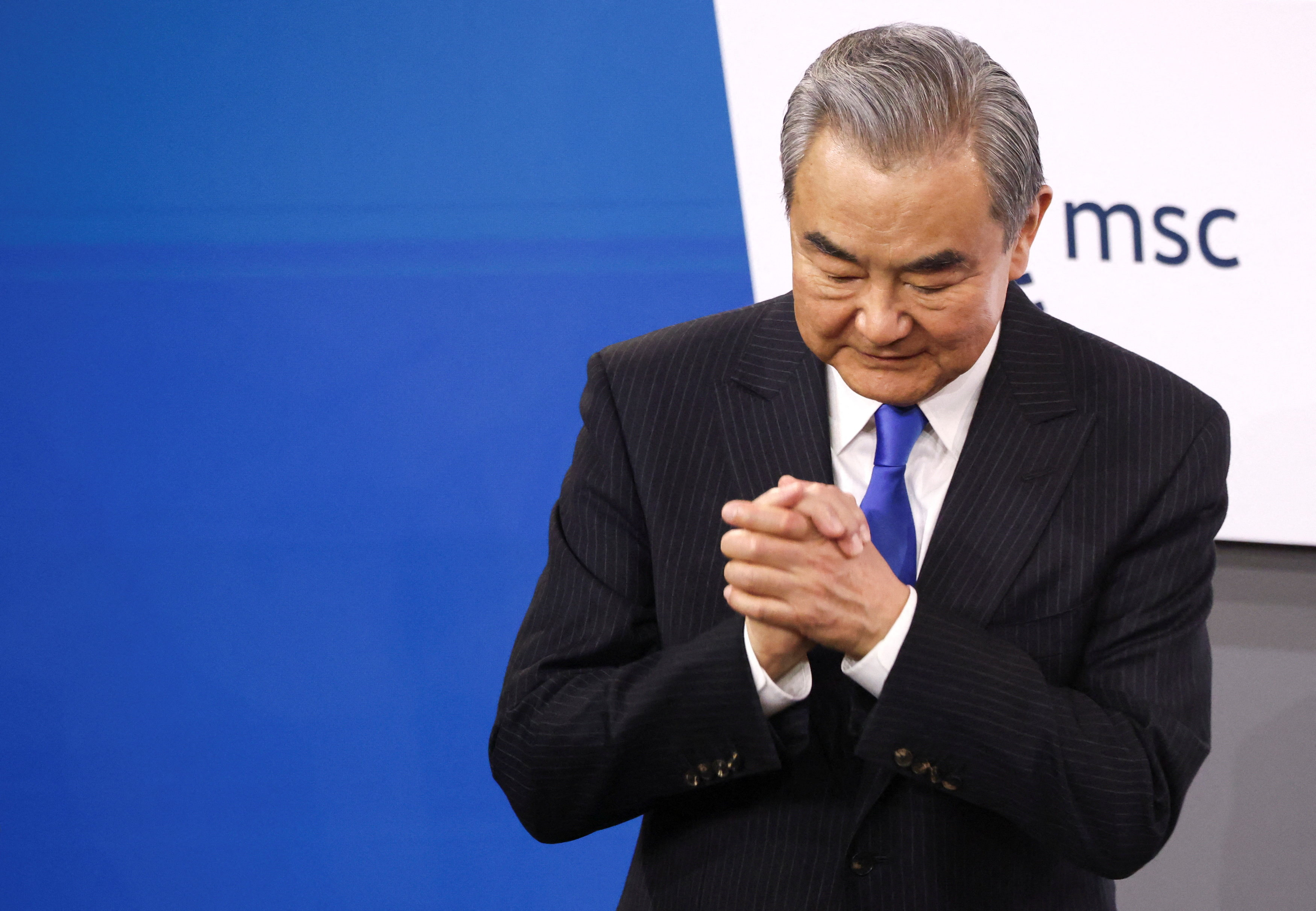 China's Foreign Minister Wang Yi gestures during the Munich Security Conference (MSC) in Munich, Germany, February 14, 2026. REUTERS/Liesa Johannssen