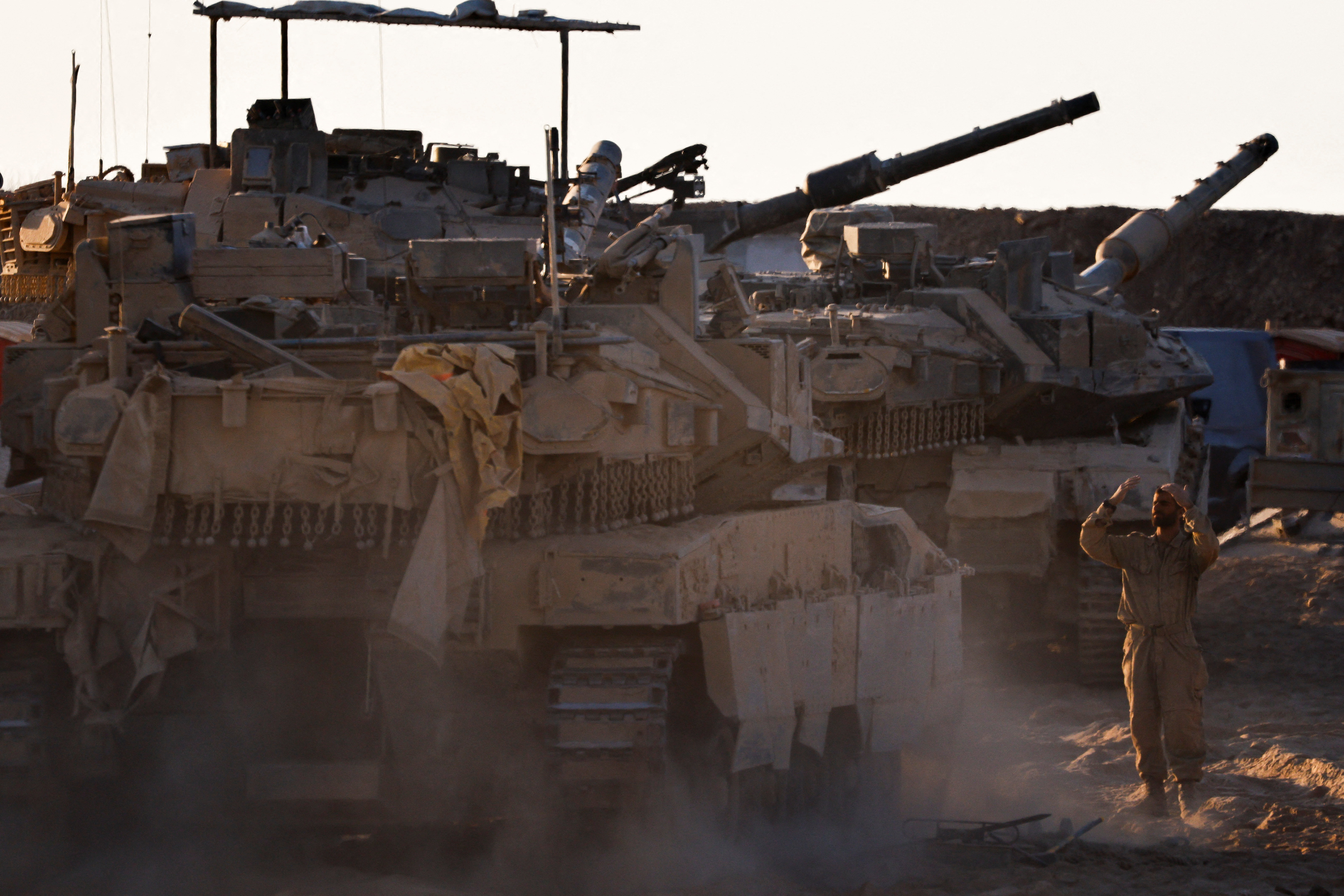 An Israeli soldier directs a tank near the border with Gaza, in Israel September 4, 2025. REUTERS/Amir Cohen