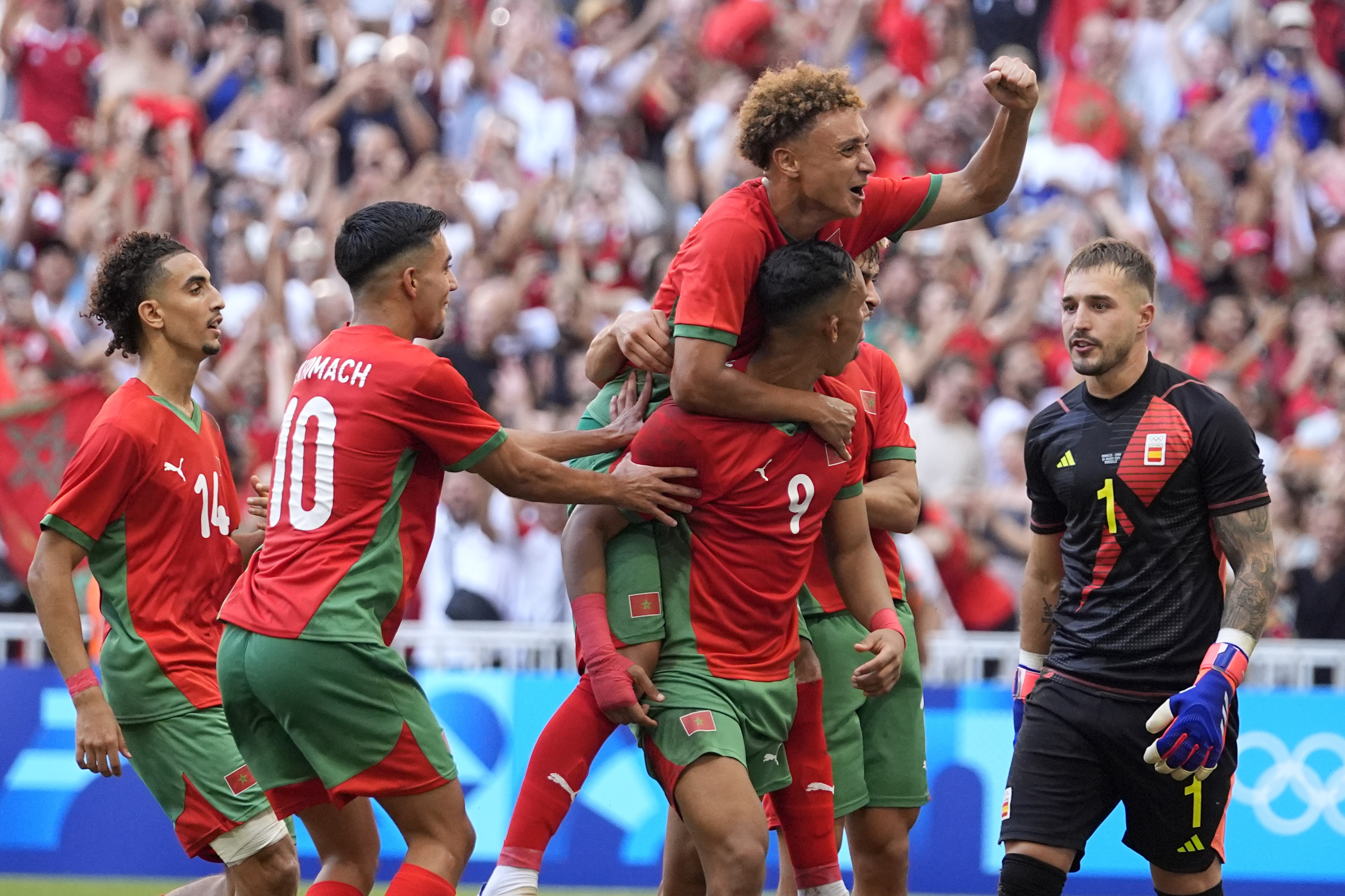 Morocco's Soufiane Rahimi celebrates scoring a penalty goal during a men's semifinal soccer match between Morocco and Spain at the 2024 Summer Olympics, Monday, Aug. 5, 2024, at Marseille Stadium in Marseille, France. (AP Photo/Julio Cortez)