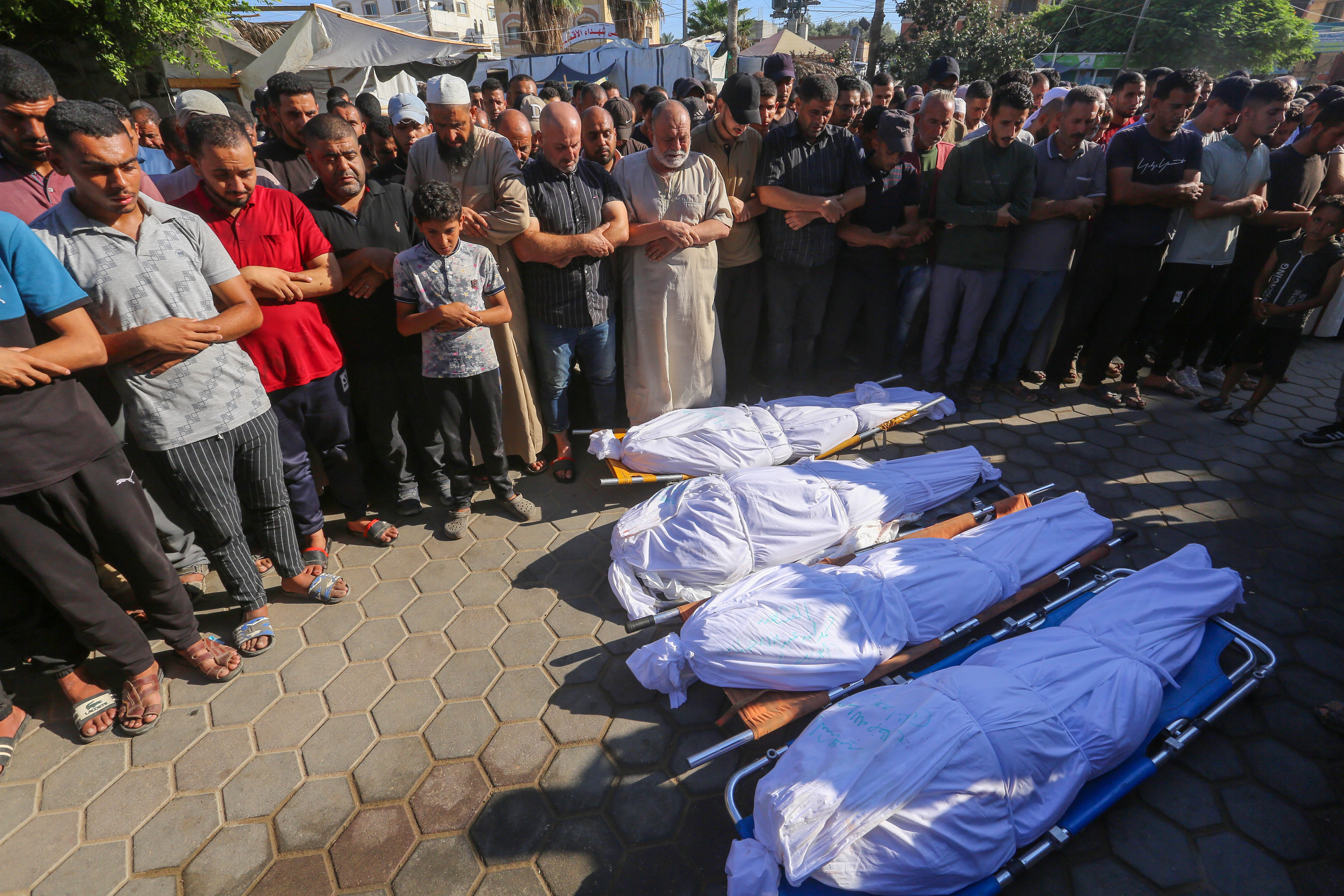 DEIR AL BALAH, GAZA - SEPTEMBER 05: People attend the funeral ceremony of 4 Palestinians who lost their lives in Israeli attacks on the tents of displaced Palestinians in the yard of Al Aqsa Martyrs Hospital in Deir Al Balah, Gaza on September 05, 2024. (Photo by Ashraf Amra/Anadolu via Getty Images)