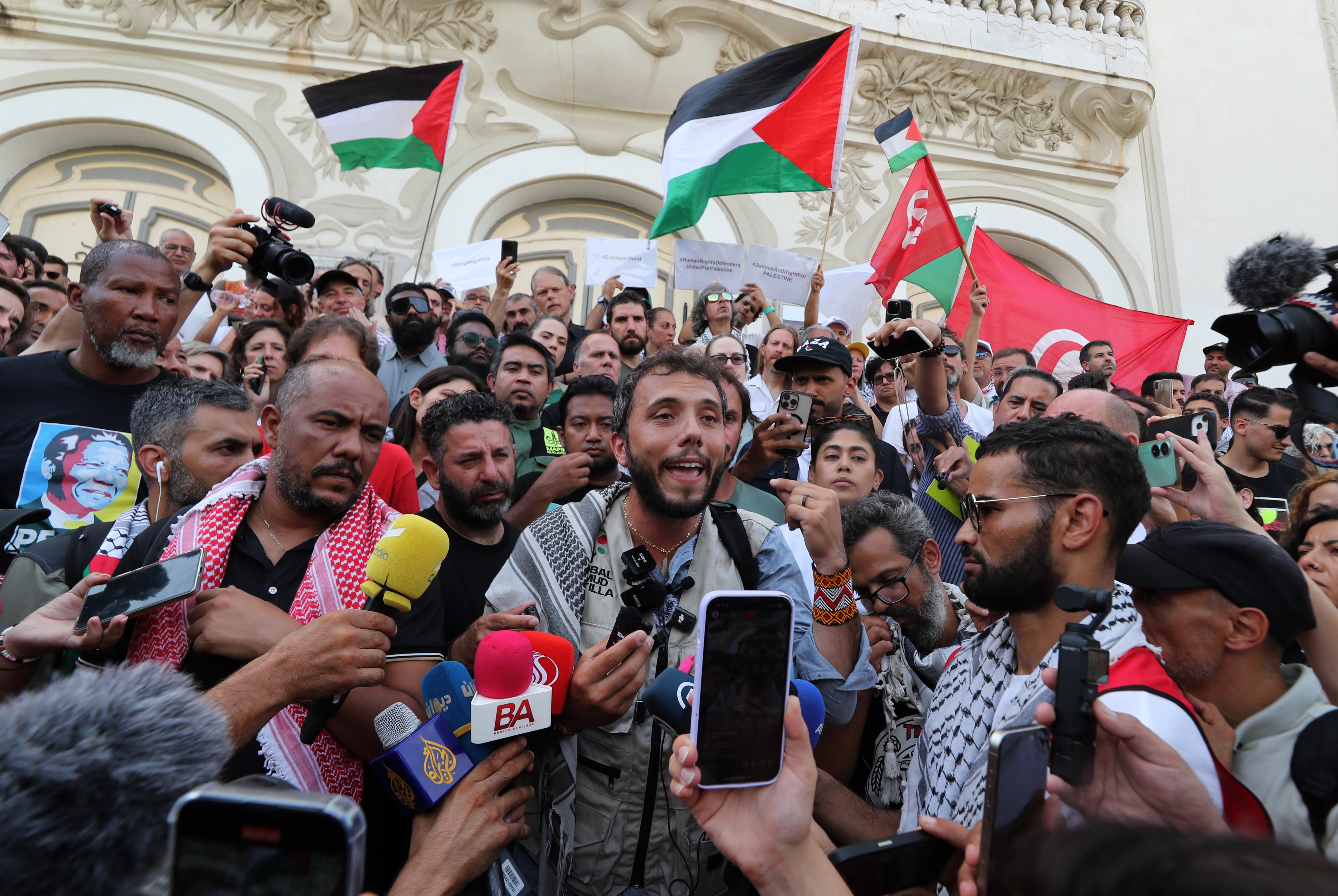Tunis (Tunisia), 09/09/2025.- Brazilian activist Thiago Avila speaks to the media one day after a drone attack on the Al-Dhamir humanitarian ship in Tunisian waters off Tunis, Tunisia, 09 September 2025. The Global Sumud Flotilla for Gaza announced on 09 September that one of its main vessels was reportedly targeted by a drone while in Tunisian waters. The six people on board, both passengers and crew, were not injured. According to the WFTU statement, the ship, which sails under the Portuguese flag and carries the initiative's steering committee, suffered damage following a fire affecting the main deck and a storage area. A spokesperson for the Tunisian National Guard, interviewed by Mosaique FM radio, rejected the theory of an airstrike. According to the first inspection, the explosion that caused the fire probably started inside the ship. (Túnez, Túnez) EFE/EPA/MOHAMED MESSARA 95710
