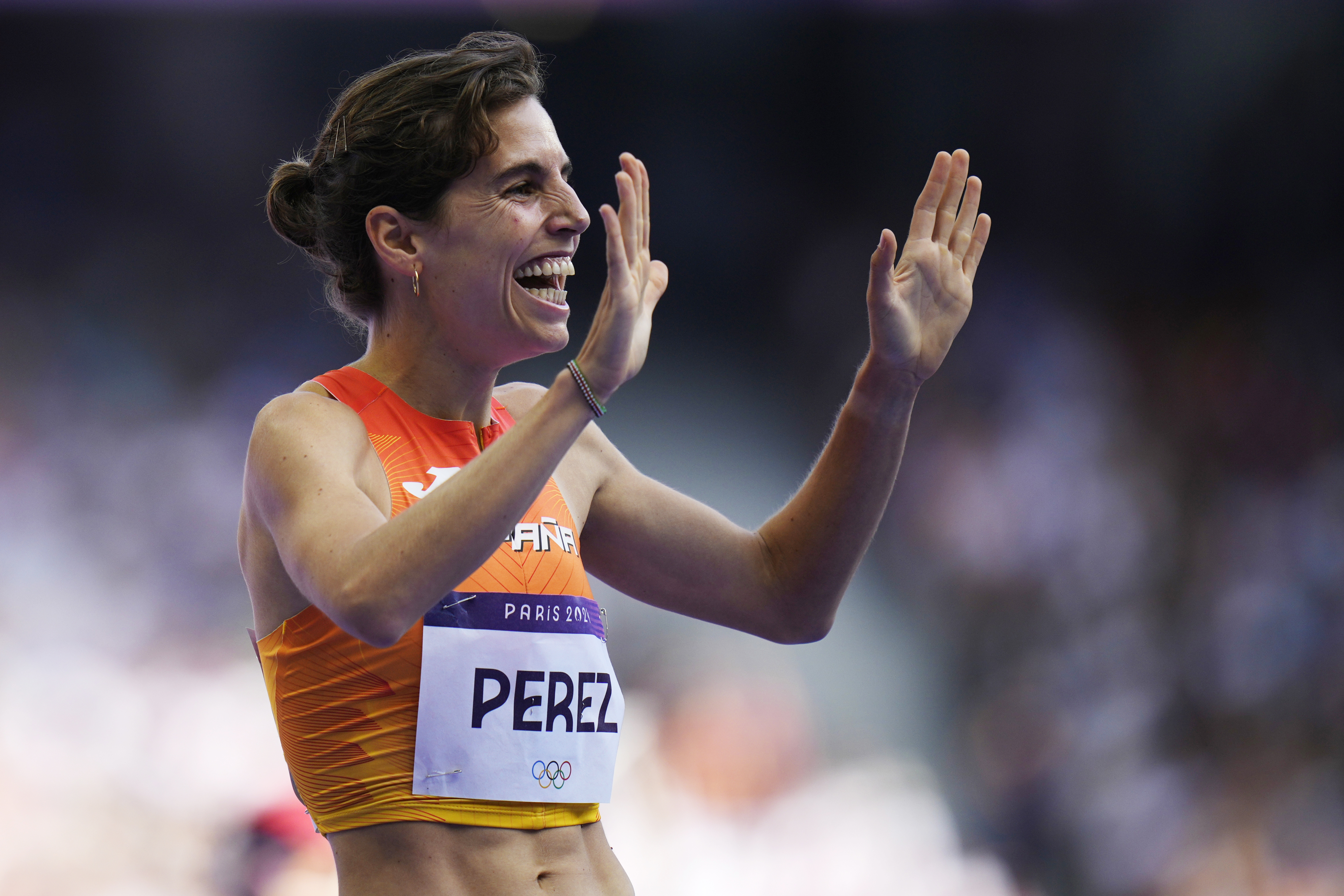 Marta Perez, of Spain, reacts after her women's 1500-meters heat at the 2024 Summer Olympics, Tuesday, Aug. 6, 2024, in Saint-Denis, France. (AP Photo/Petr David Josek)