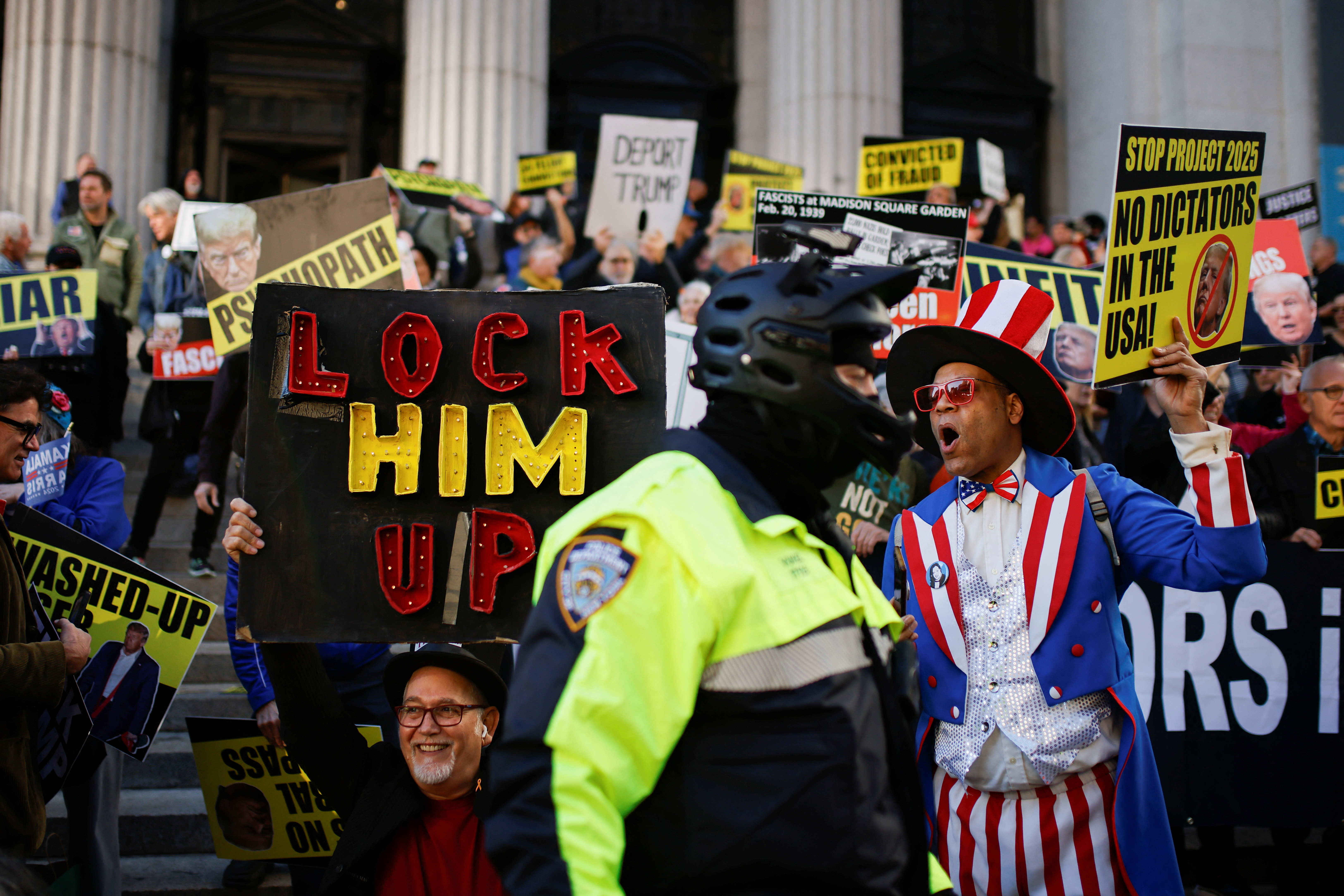 Opponents of Republican presidential nominee and former U.S. President Donald Trump protest on the day of a rally for him that will be held in Madison Square Garden, in New York, U.S., October 27, 2024. REUTERS/Eduardo Munoz