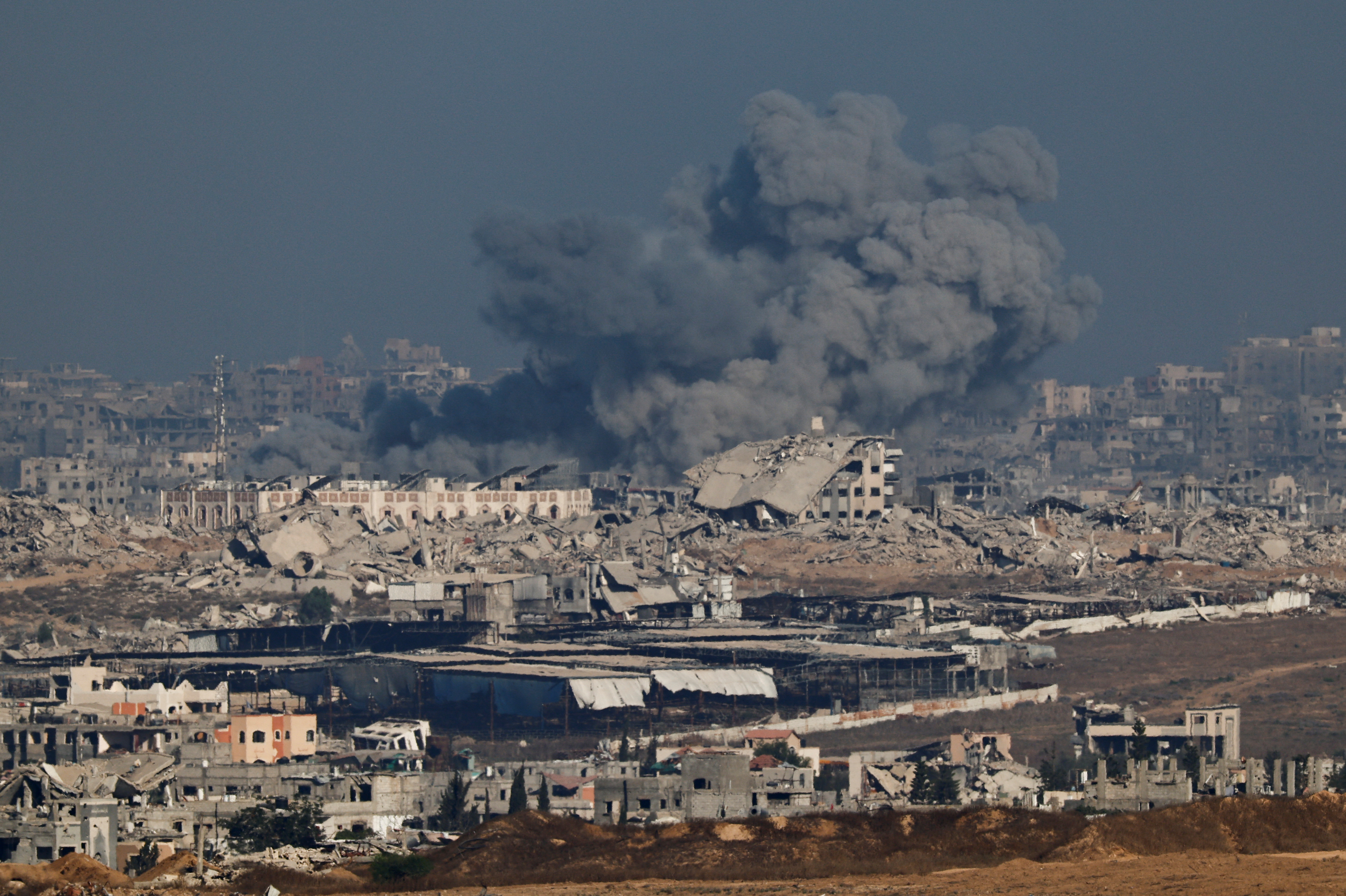 Smoke rises in Gaza after an explosion, as seen from the Israeli side of the border, July 7, 2025. REUTERS/Amir Cohen