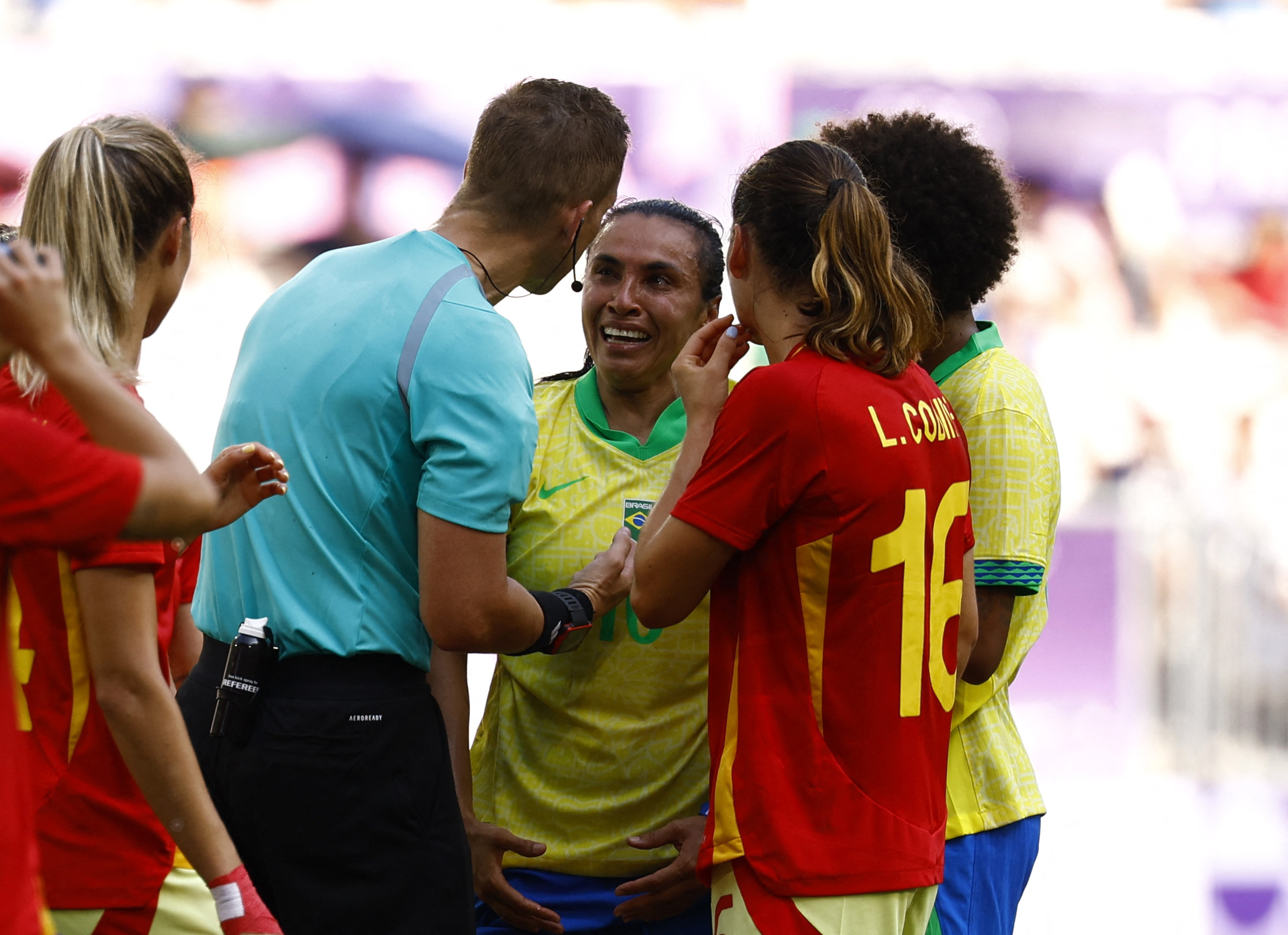 Paris 2024 Olympics - Football - Women's Group C - Brazil vs Spain - Bordeaux Stadium, Bordeaux, France - July 31, 2024. Marta of Brazil talks to referee Espen Eskas after being shown a red card. REUTERS/Susana Vera