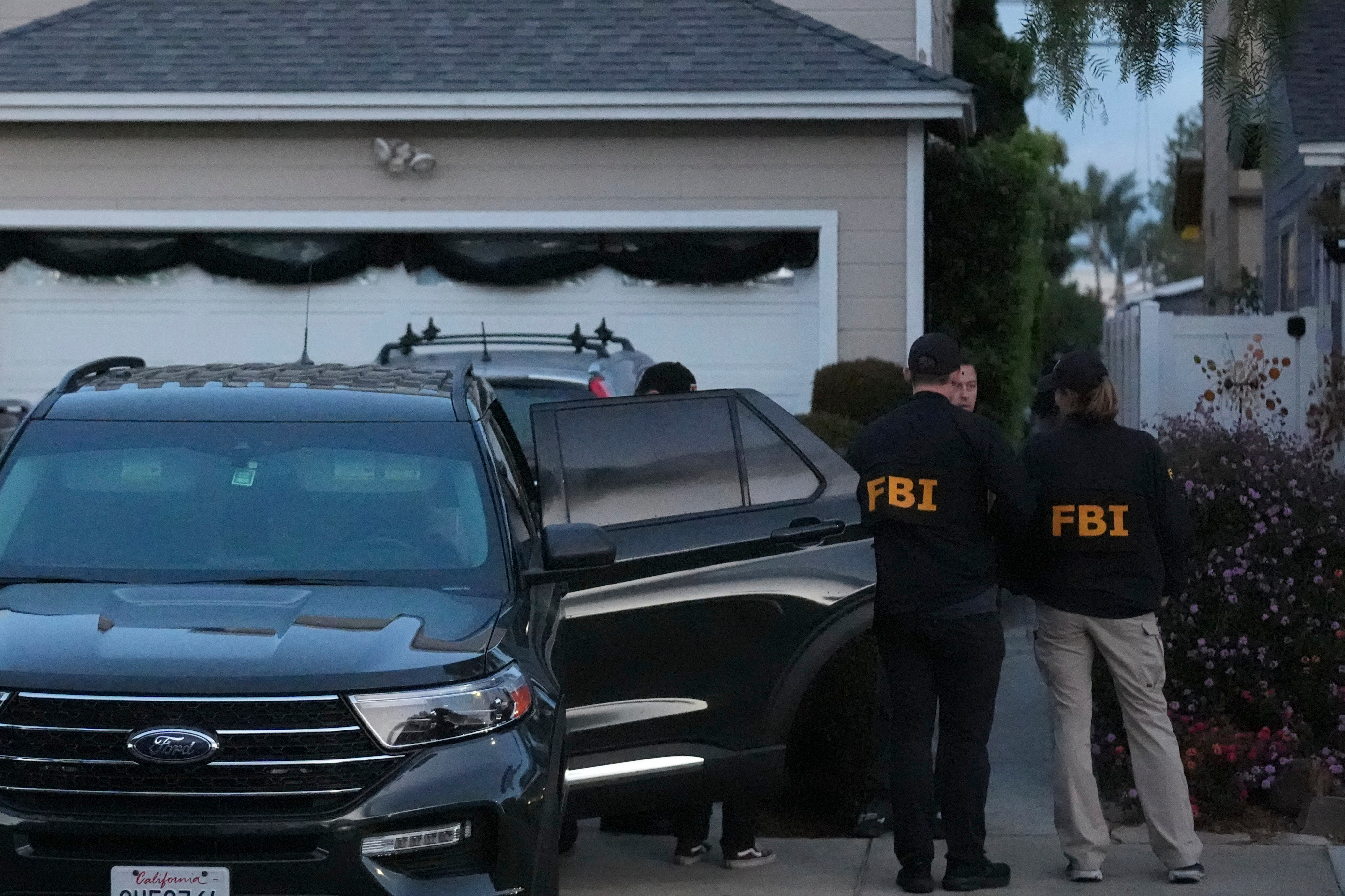 FBI agents work Sunday, April 26, 2026, at an address in Torrance, Calif., connected to Cole Tomas Allen, who was identified as the shooting suspect at the White House Correspondents Dinner the night before. (AP Photo/Damian Dovarganes)