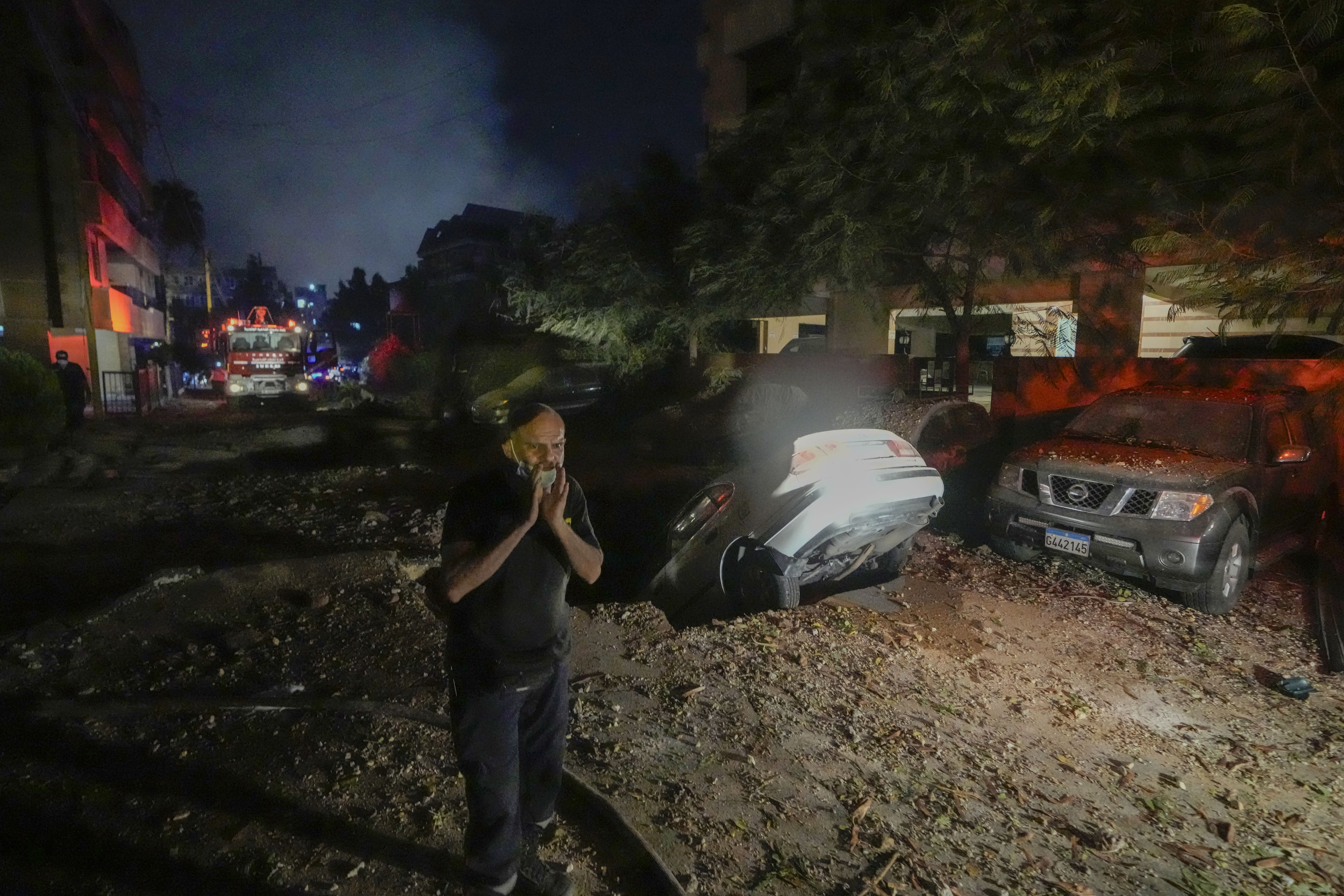 A man reacts at the site of an Israeli airstrike in Beirut's southern suburbs Friday, Sept. 27, 2024. (AP Photo/Bilal Hussein)