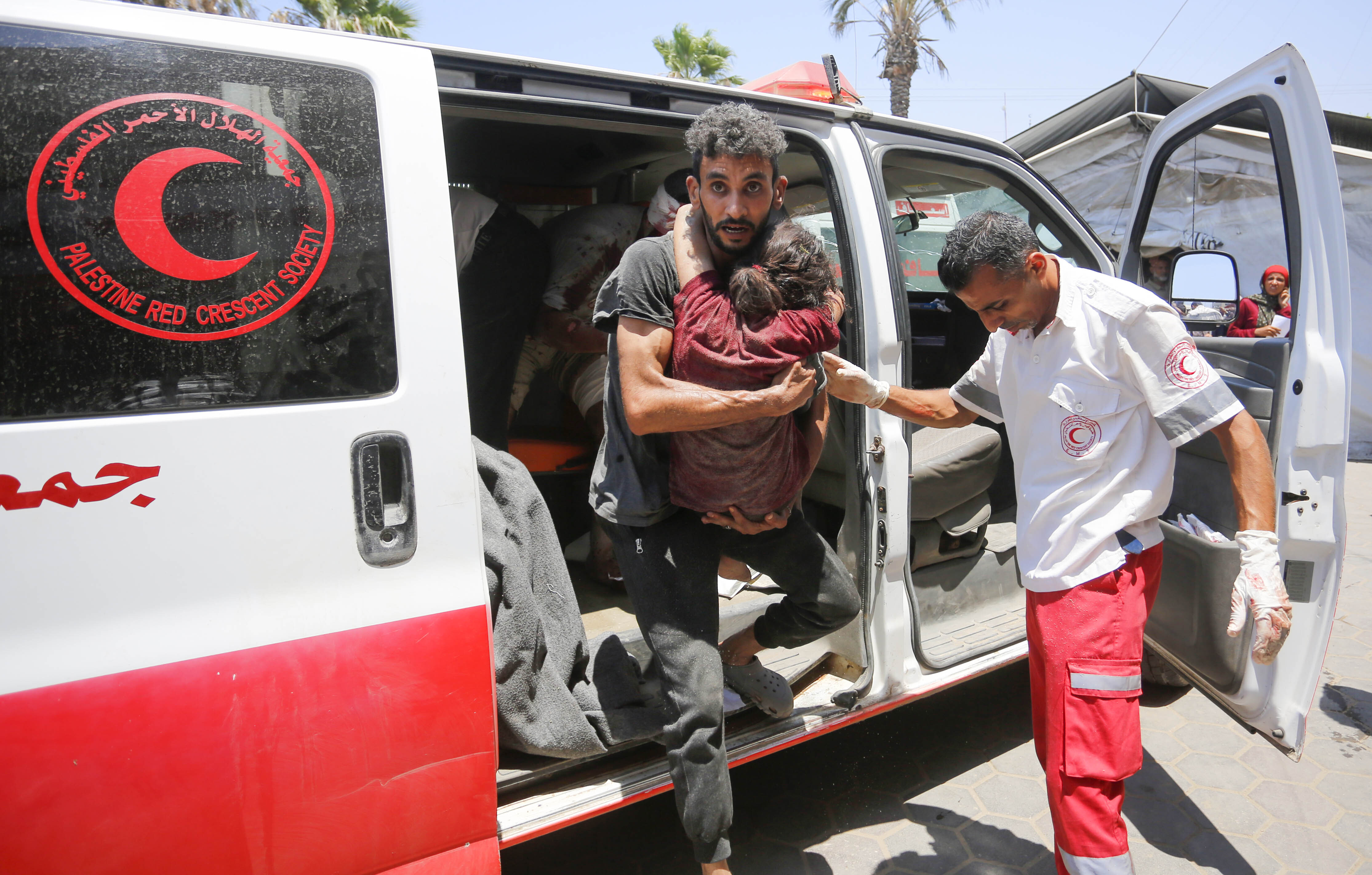 Injured Palestinians, including children, are brought to Al-Aqsa Martyr's Hospital for medical treatment after the Israeli attacks on Deir al-Balah, Gaza on July 15, 2024. It was reported that there were dead and injured people as a result of the Israeli attack. (Photo by Ashraf Amra/Anadolu via Getty Images)