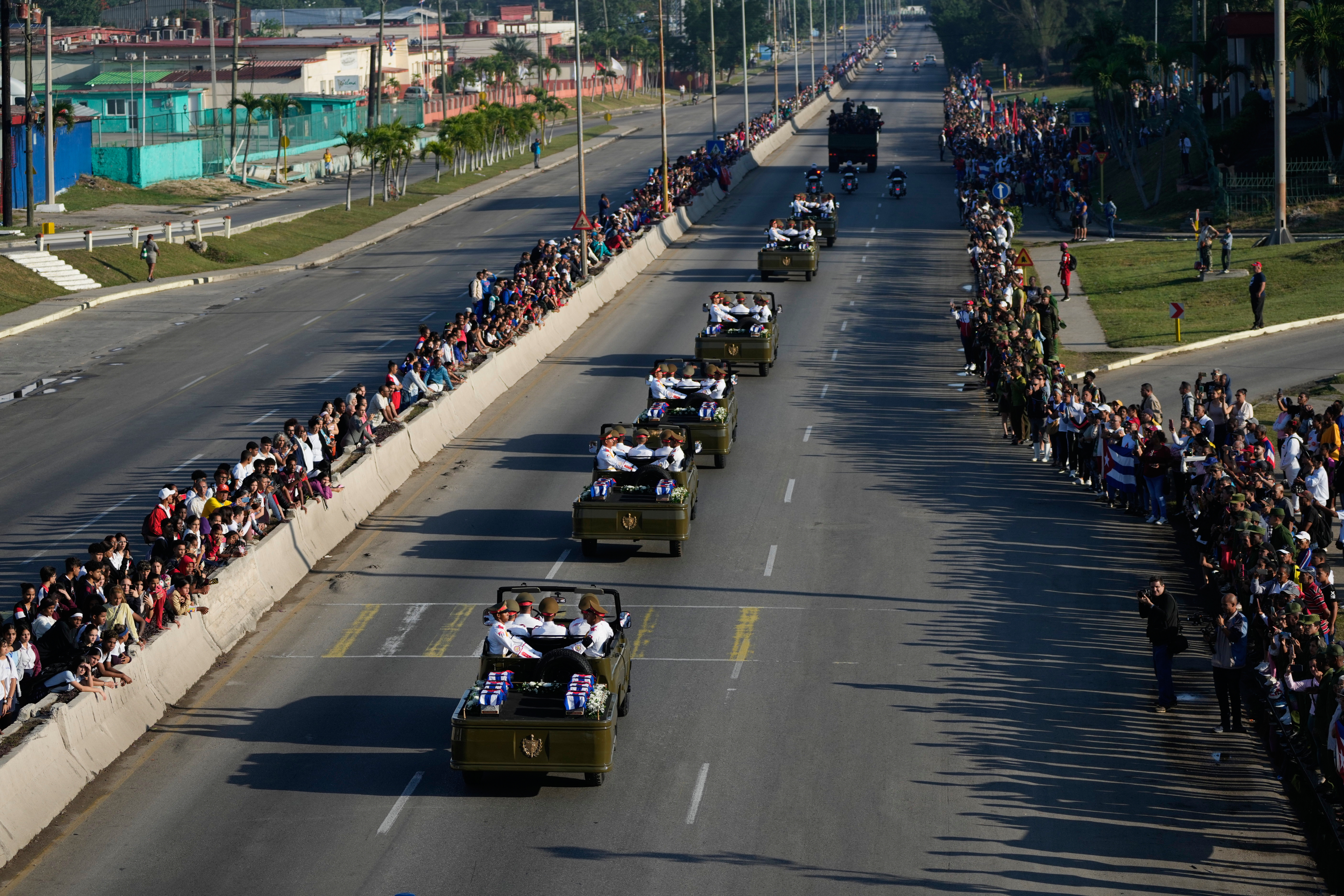 A motorcade transports the coffins of Cuban officers, who were killed during the U.S. operation in Venezuela that captured Venezuelan President Nicolas Maduro, through Havana, Cuba, Thursday, Jan. 15, 2026. (AP Photo/Ramon Espinosa)