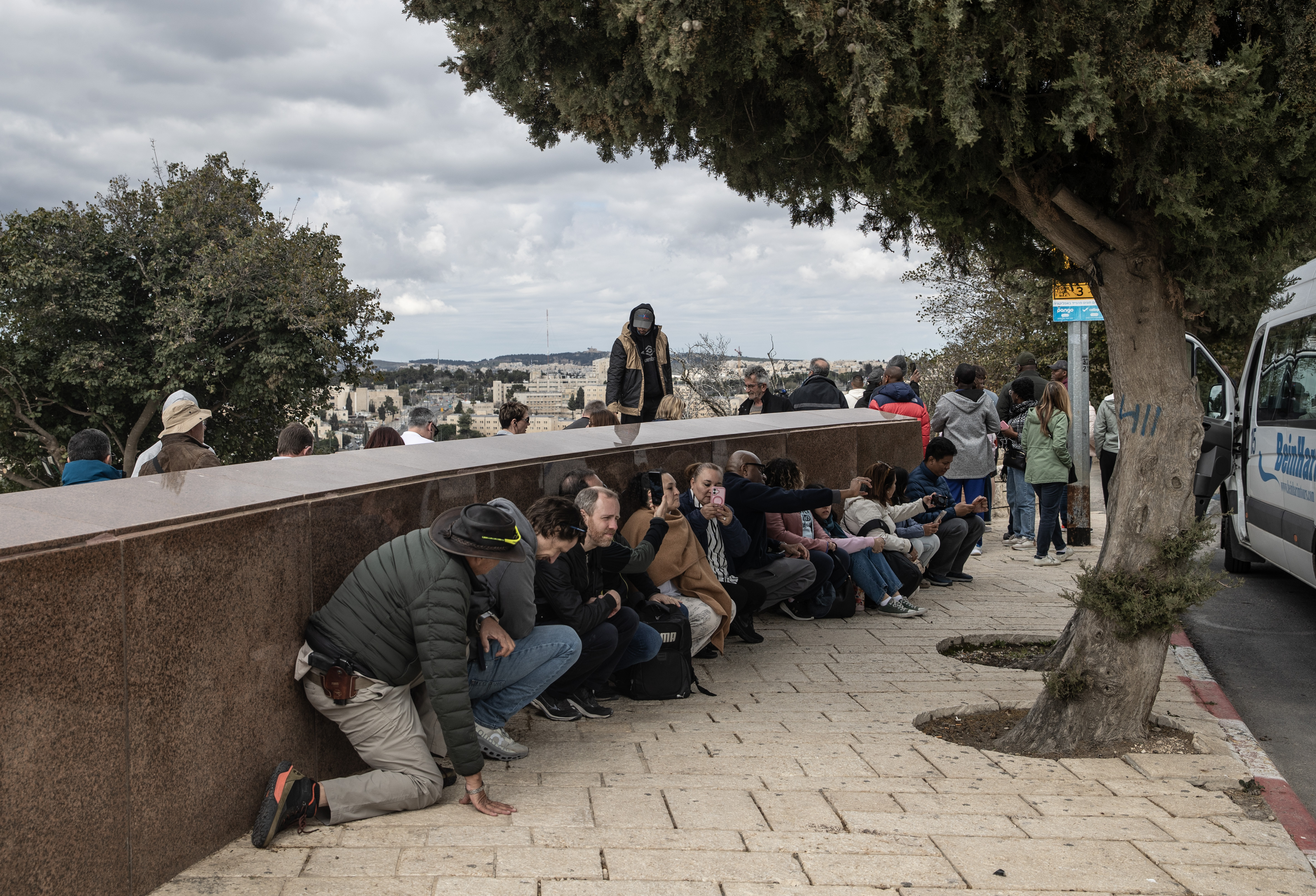JERUSALEM - FEBRUARY 28: People take shelter as Iran launched missiles and drones towards Israel following the US-Israeli attacks, in Jerusalem on February 28, 2026. Israeli air defence systems destroyed some of the missiles launched by Iran, as sirens are heard in the city. (Photo by Mostafa Alkharouf/Anadolu via Getty Images)