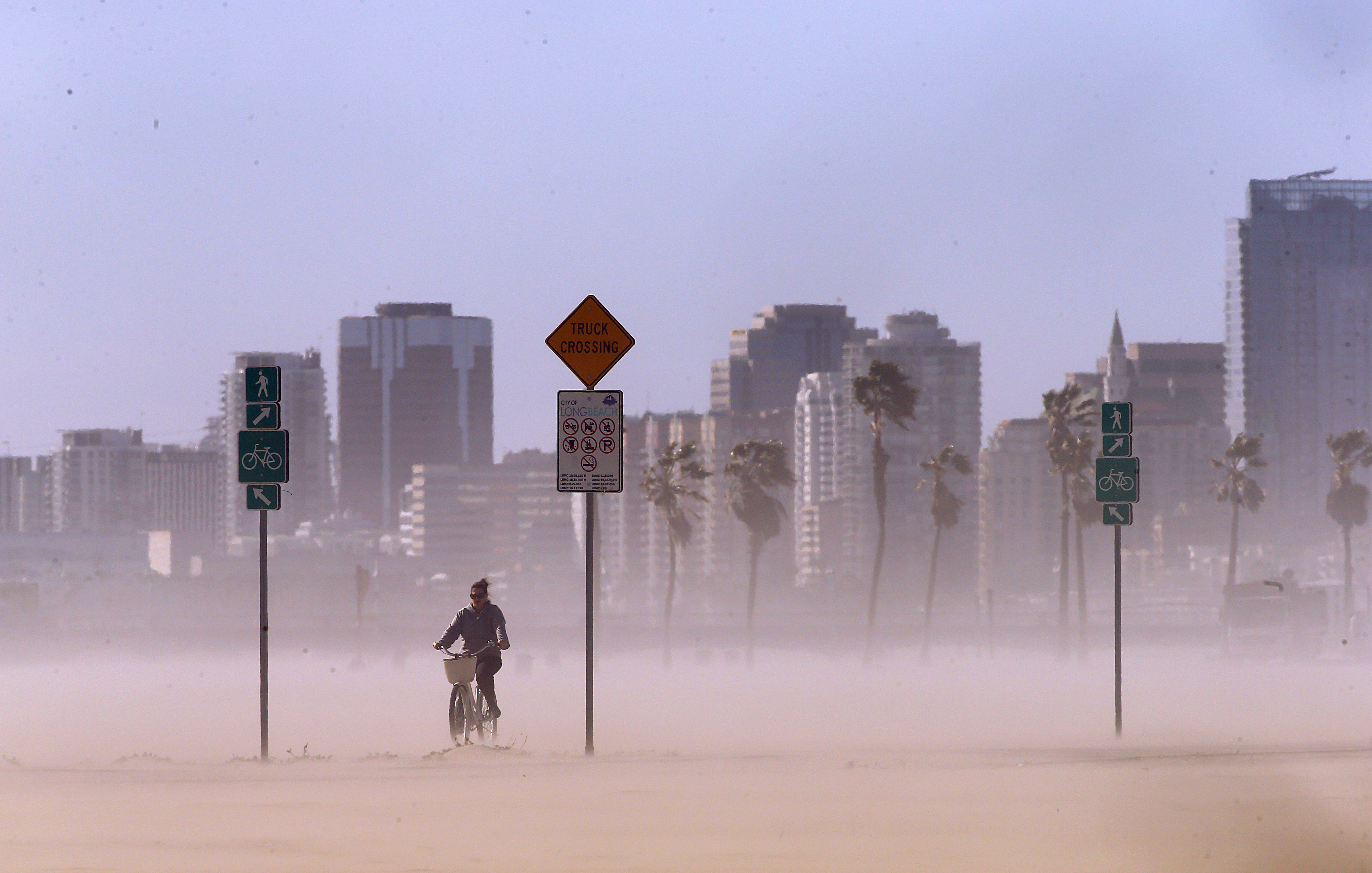 LONG BEACH, CALIF. - FEB. 22, 2023. Gusty winds kick up sand and dust in Long Beach on Wednesday, Feb. 22, 2023. More cold and wet weather, with high winds and surf, are forecast for Southern California as a Canadian cold front moves through the region this week. (Luis Sinco / Los Angeles Times via Getty Images)