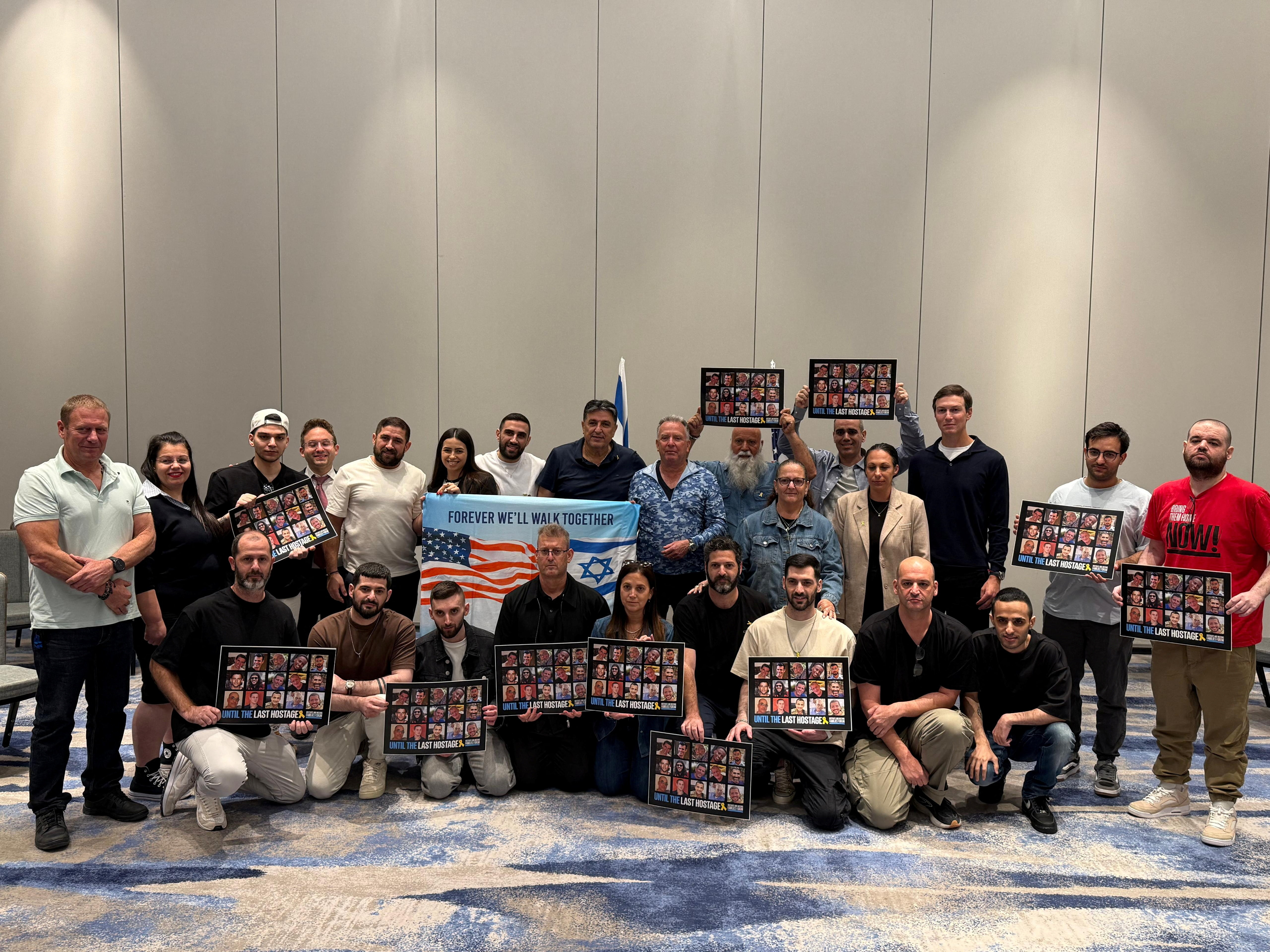 U.S. Special Envoy to the Middle East Steve Witkoff and Jared Kushner stand with recently released hostages including Omri Miran, Gali Berman, Ziv Berman, Yosef-Chaim Ohana, Matan Angrest, Segev Kalfon, Nimrod Cohen and Eitan Horn, who were kidnapped to Gaza in the deadly October 7 attack by Hamas, in Tel Aviv,	Israel, in this handout from October 21, 2025. The Hostages Families Forum/Handout via REUTERS    THIS IMAGE HAS BEEN SUPPLIED BY A THIRD PARTY. MANDATORY CREDIT. 