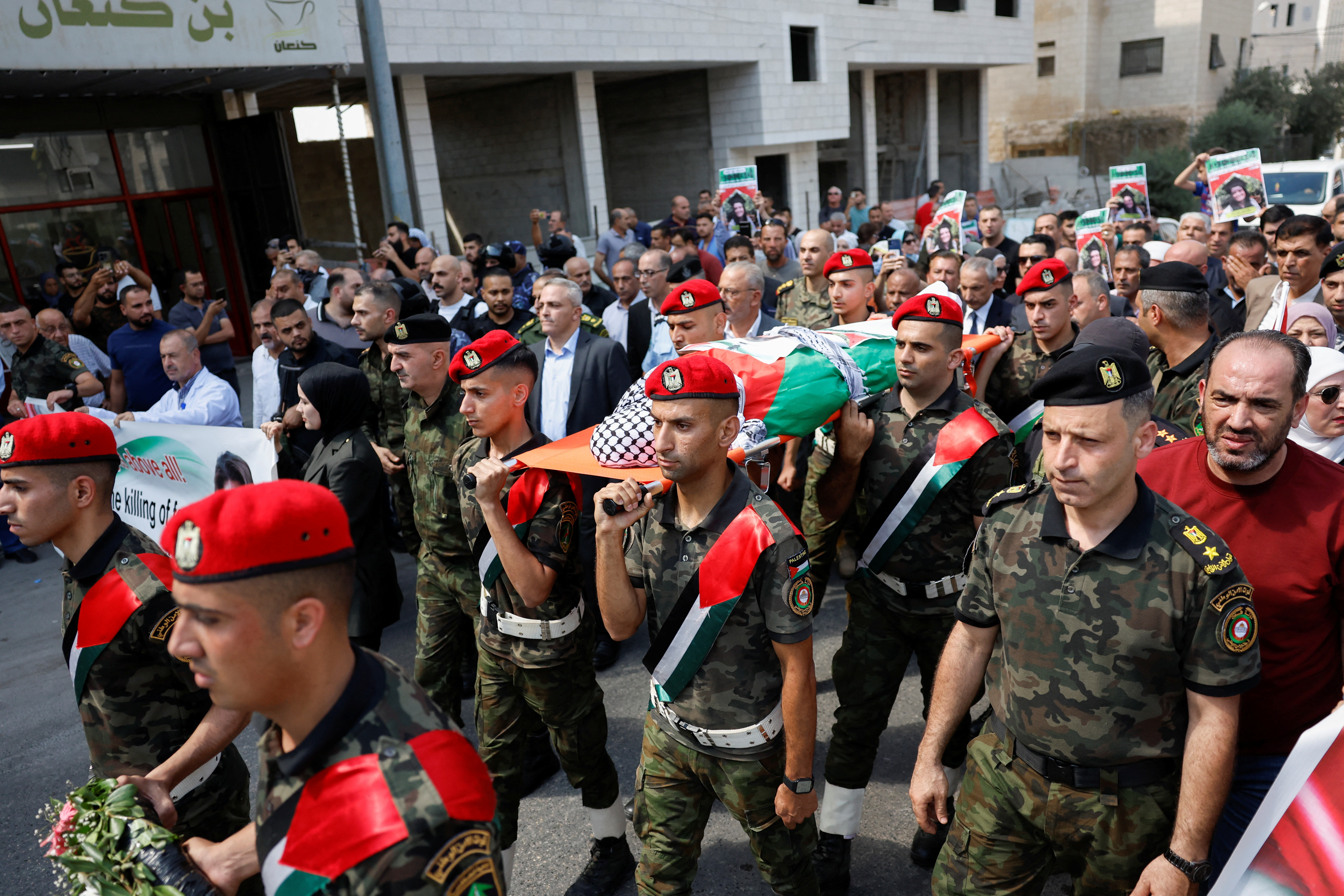 Members of Palestinian security forces carry the body of Turkish-American activist Aysenur Ezgi Eygi, during a procession honouring her, after she was shot dead by Israeli forces, according to Palestinian and Turkish officials, in Nablus, in the Israeli-occupied West Bank September 9, 2024. REUTERS/Mohammed Torokman