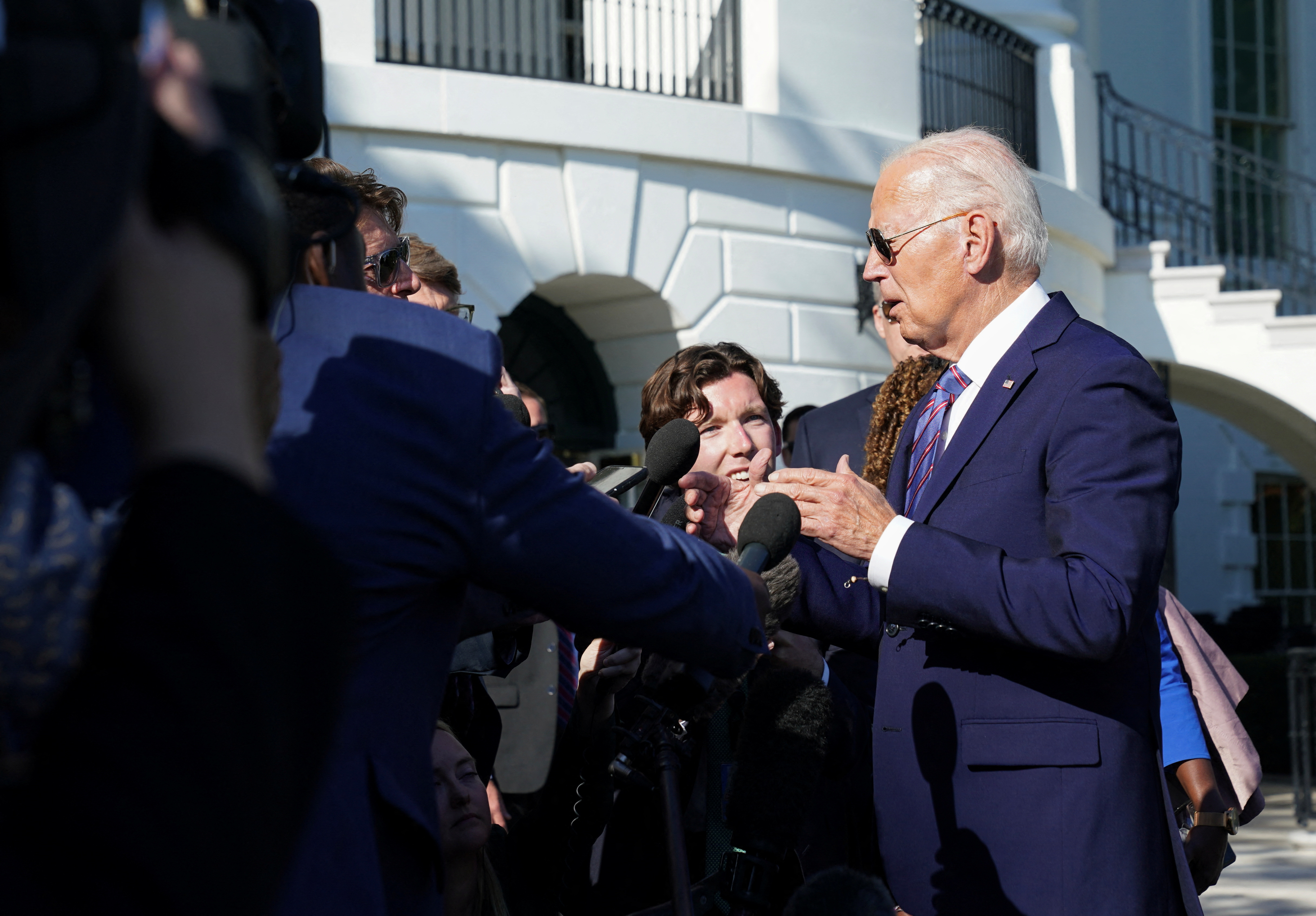 U.S. President Joe Biden speaks to reporters as he departs from the White House in Washington, U.S., September 10, 2024. REUTERS/Kevin Lamarque