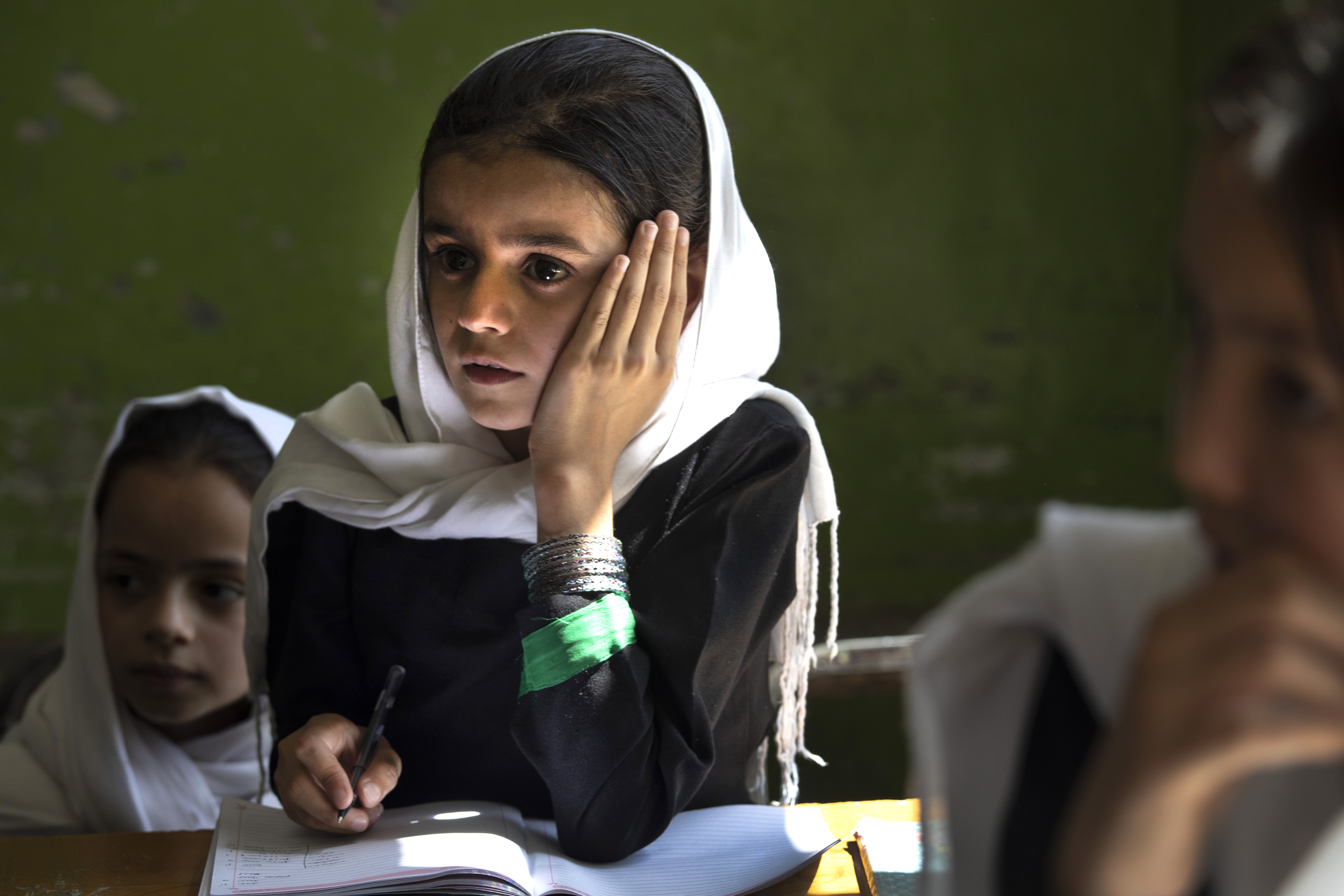 Sanawbar, 10, in a fourth grade class at Kabul's Zarghoona High School this past July.