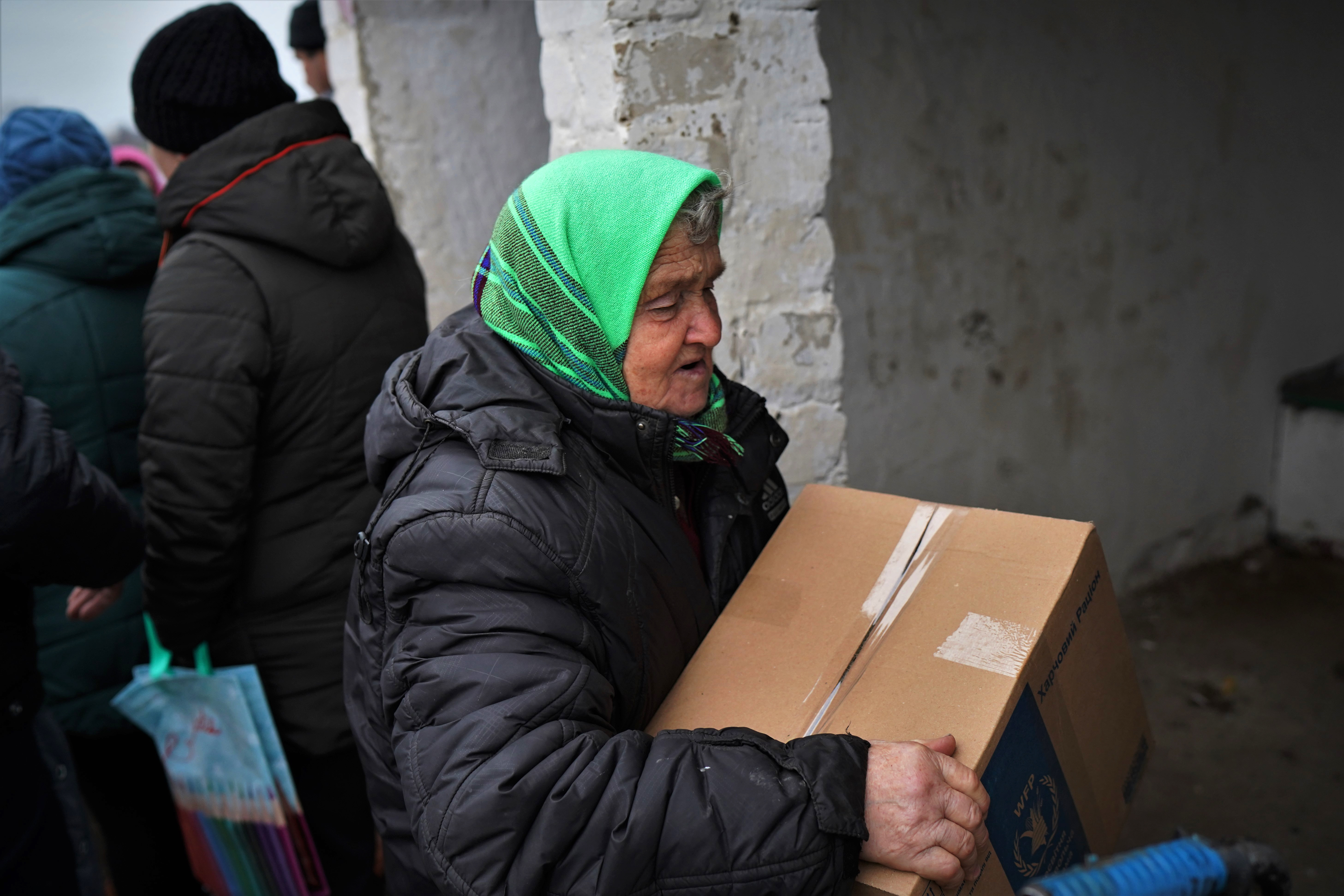 Maria Fediuk, 79, after collecting food delivered by a humanitarian organization in Hnilitsia.