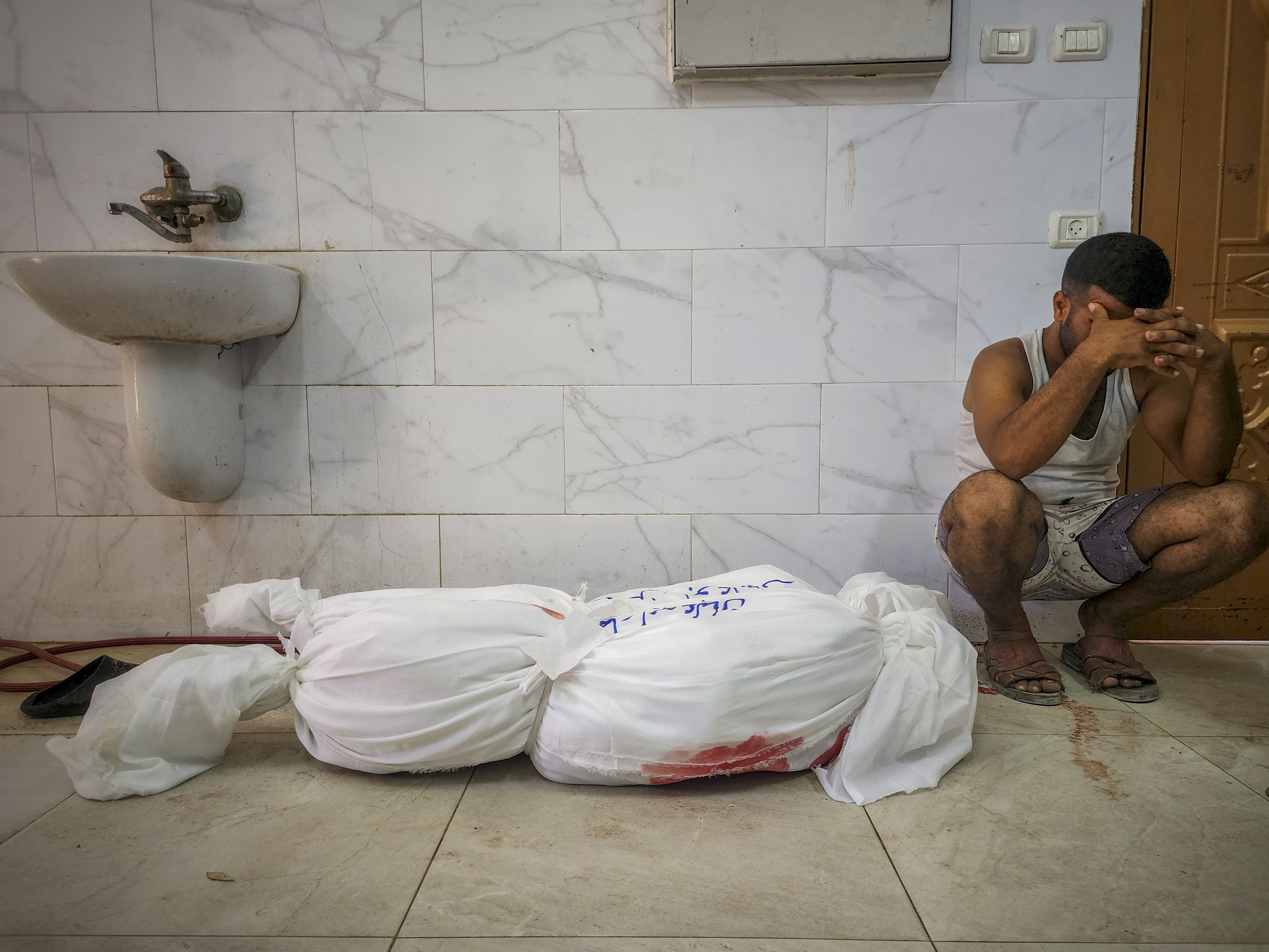 Relatives of Palestinians who lost their lives as a result of Israeli attacks, mourn as the bodies are brought to Nasser Hospital for funeral prayer and burial in Khan Yunis, Gaza on July 17, 2024. (Photo by Hani Alshaer/Anadolu via Getty Images)