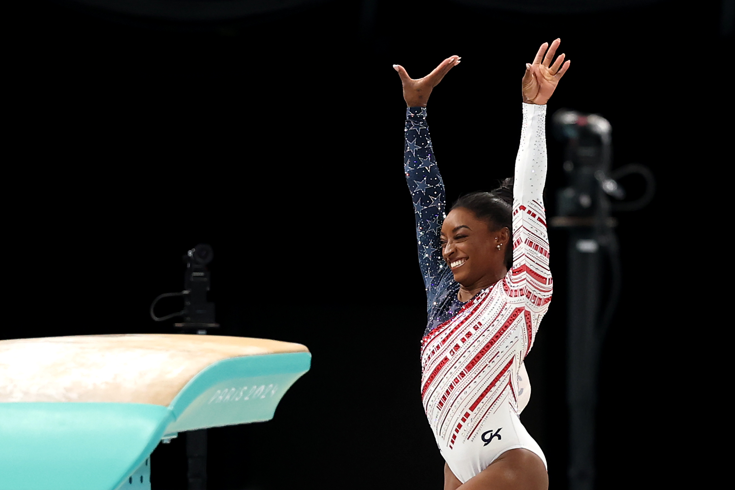 PARIS, FRANCE - JULY 30: Simone Biles of Team United States reacts after competing on the vault during the Artistic Gymnastics Women's Team Final on day four of the Olympic Games Paris 2024 at Bercy Arena on July 30, 2024 in Paris, France. (Photo by Jamie Squire/Getty Images)