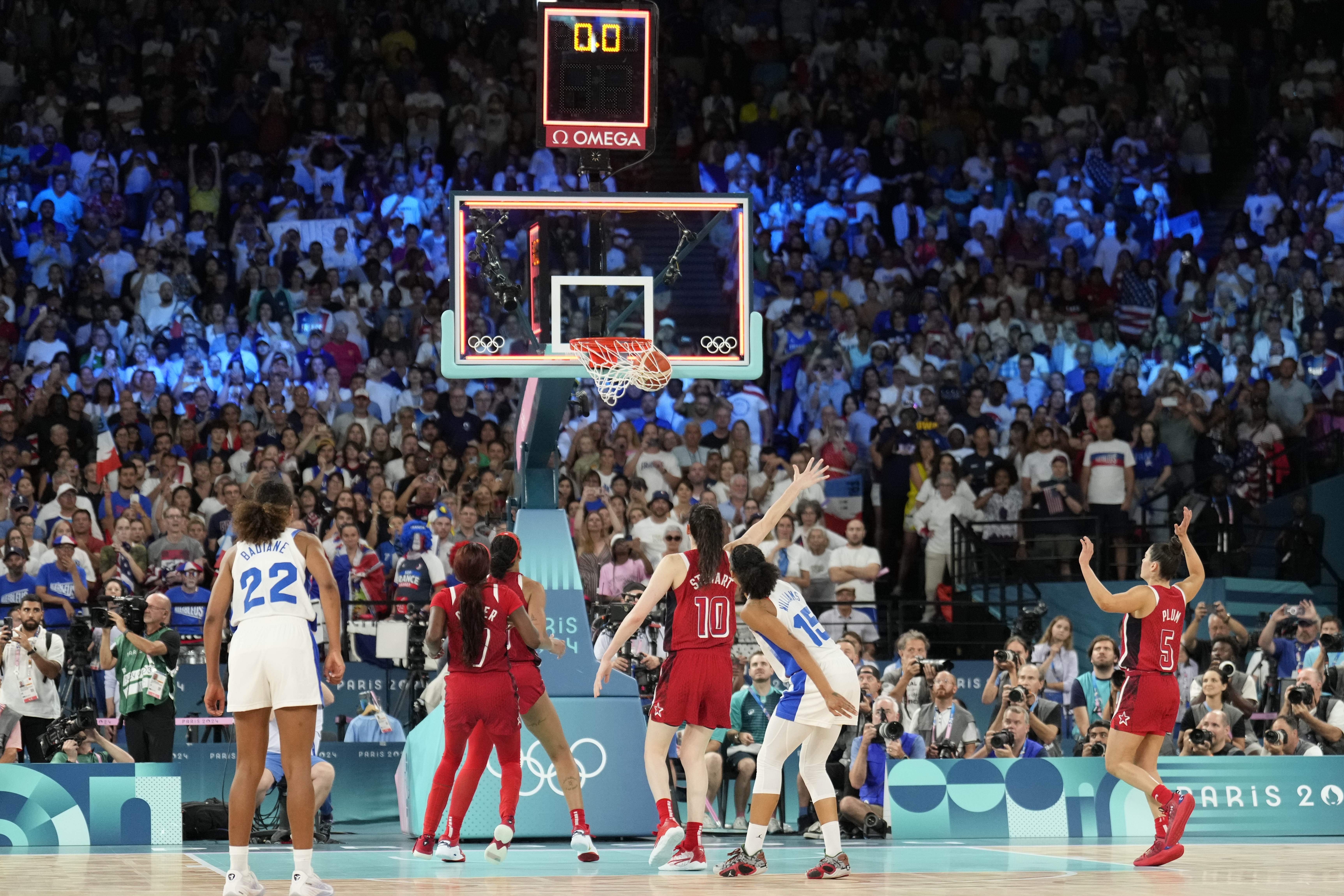 Gabby Williams (15), of France, makes a two-point basket to end a women's gold medal basketball game at Bercy Arena at the 2024 Summer Olympics, Sunday, Aug. 11, 2024, in Paris, France. (AP Photo/Mark J. Terrill)