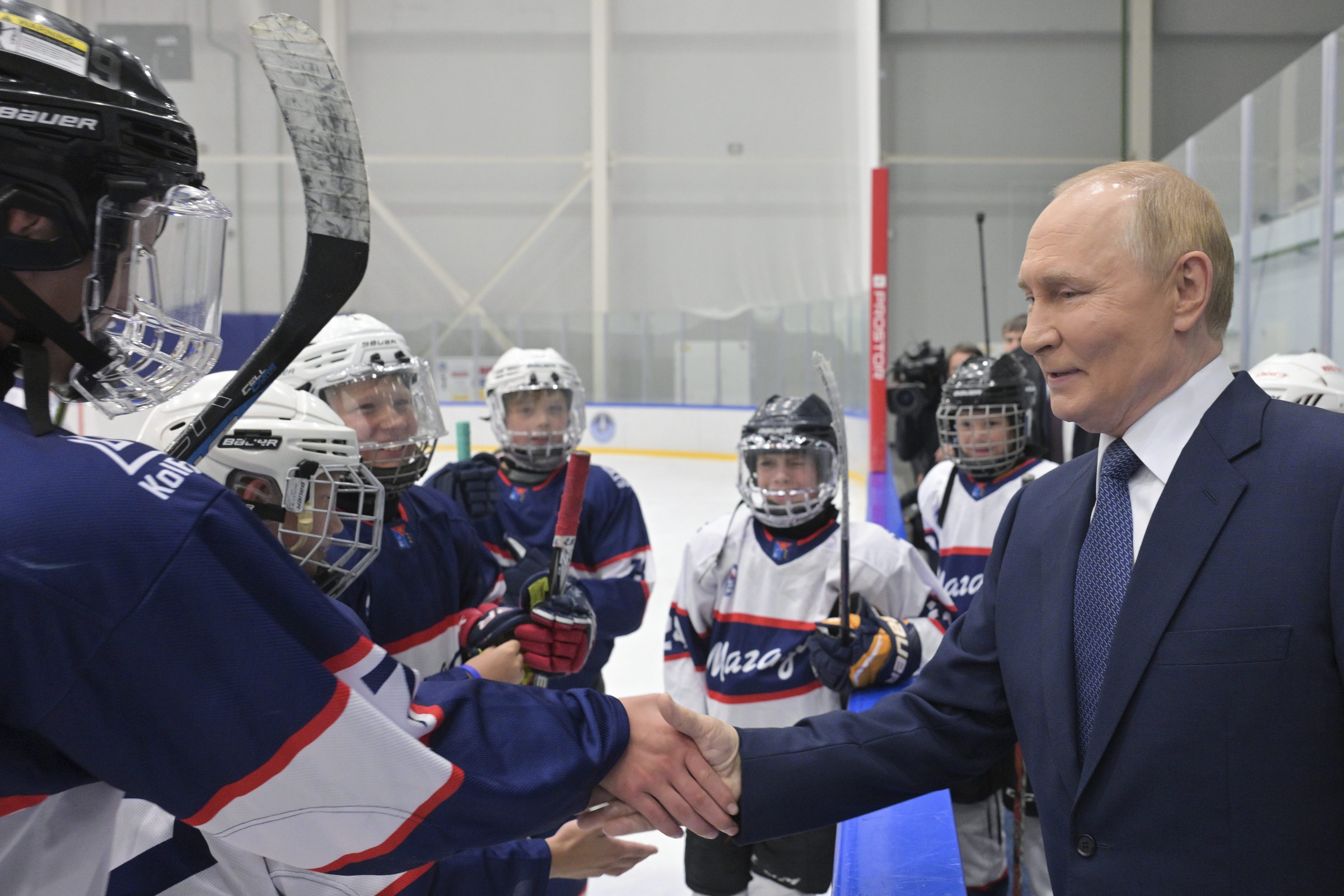 Russian President Vladimir Putin, right, visits the Prezidentsky sports and recreation complex in Magadan, about 6,000 kilometers (3,700 miles) east of Moscow, Russia's Far East, on Friday, Aug. 15, 2025, on the way to Alaska. (Alexei Nikolsky, Sputnik, Kremlin Pool Photo via AP)