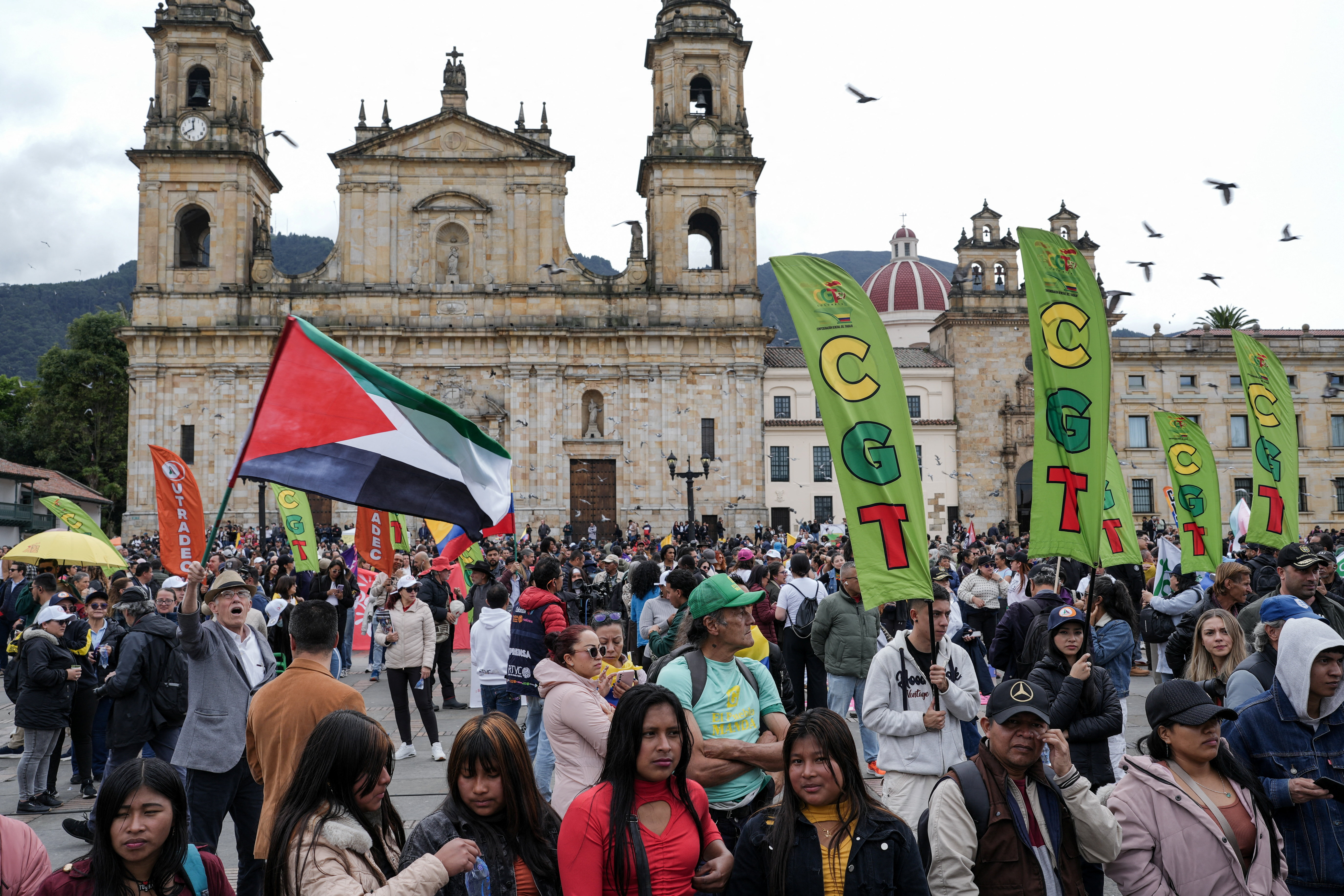 A man holds a Palestinian flag as people gather for a rally, called by Colombian presidential candidate Ivan Cepeda, in support of current President Gustavo Petro, during Petro's visit to the U.S., at Plaza de Lourdes in Bogota, Colombia, February 3, 2026. REUTERS/Nathalia Angarita