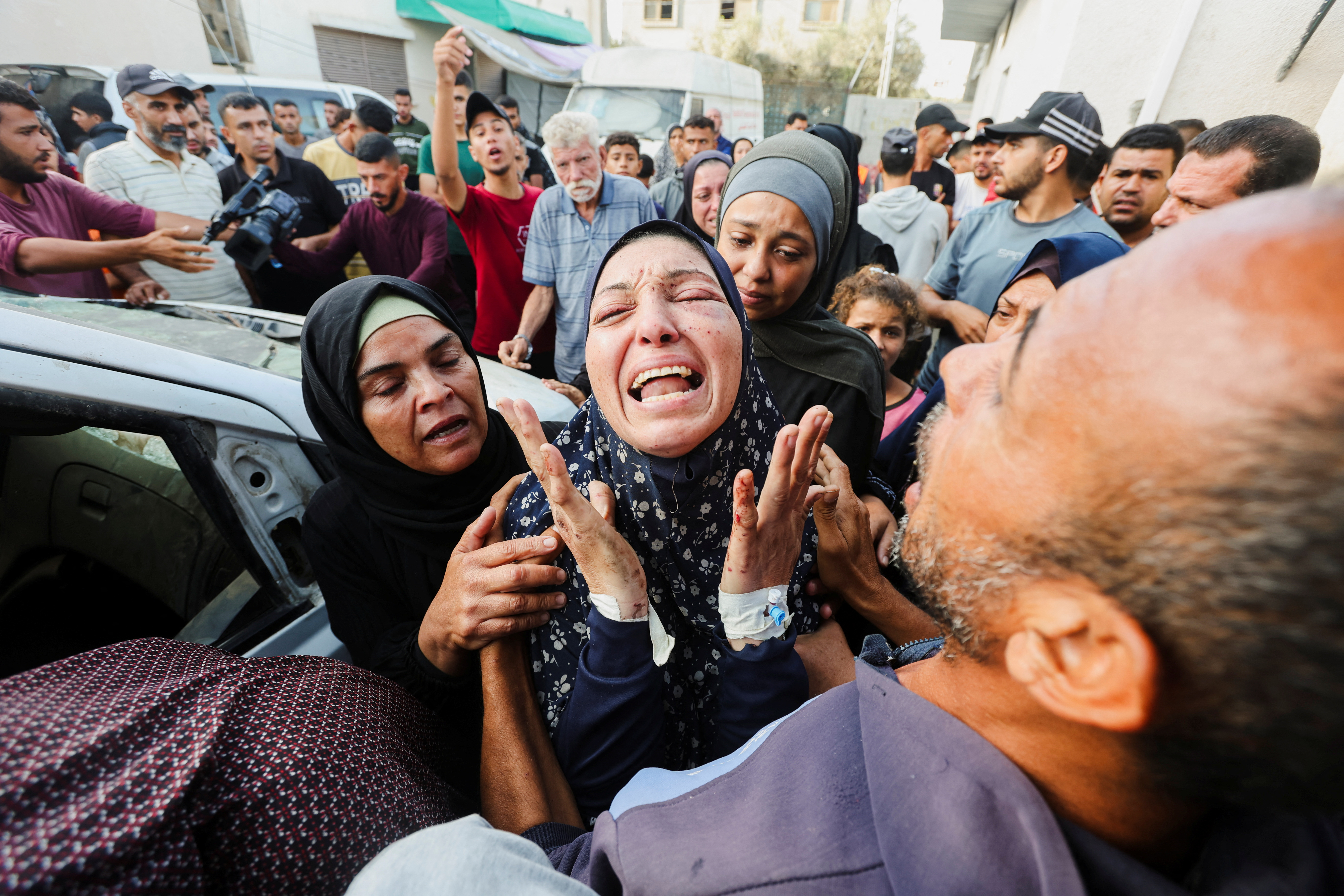 The grandmother of Palestinian boy Yaman Al-Zaanin, who was born and killed amid the ongoing Israel-Hamas conflict and lost his life in an Israeli strike on a school-turned shelter, according to medics, reacts at Al-Aqsa Martyrs Hospital in Deir Al-Balah in the central Gaza Strip, October 14, 2024. REUTERS/Ramadan Abed